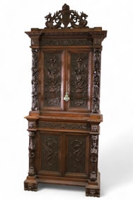 HIGHLY CARVED HUNTER'S CABINET