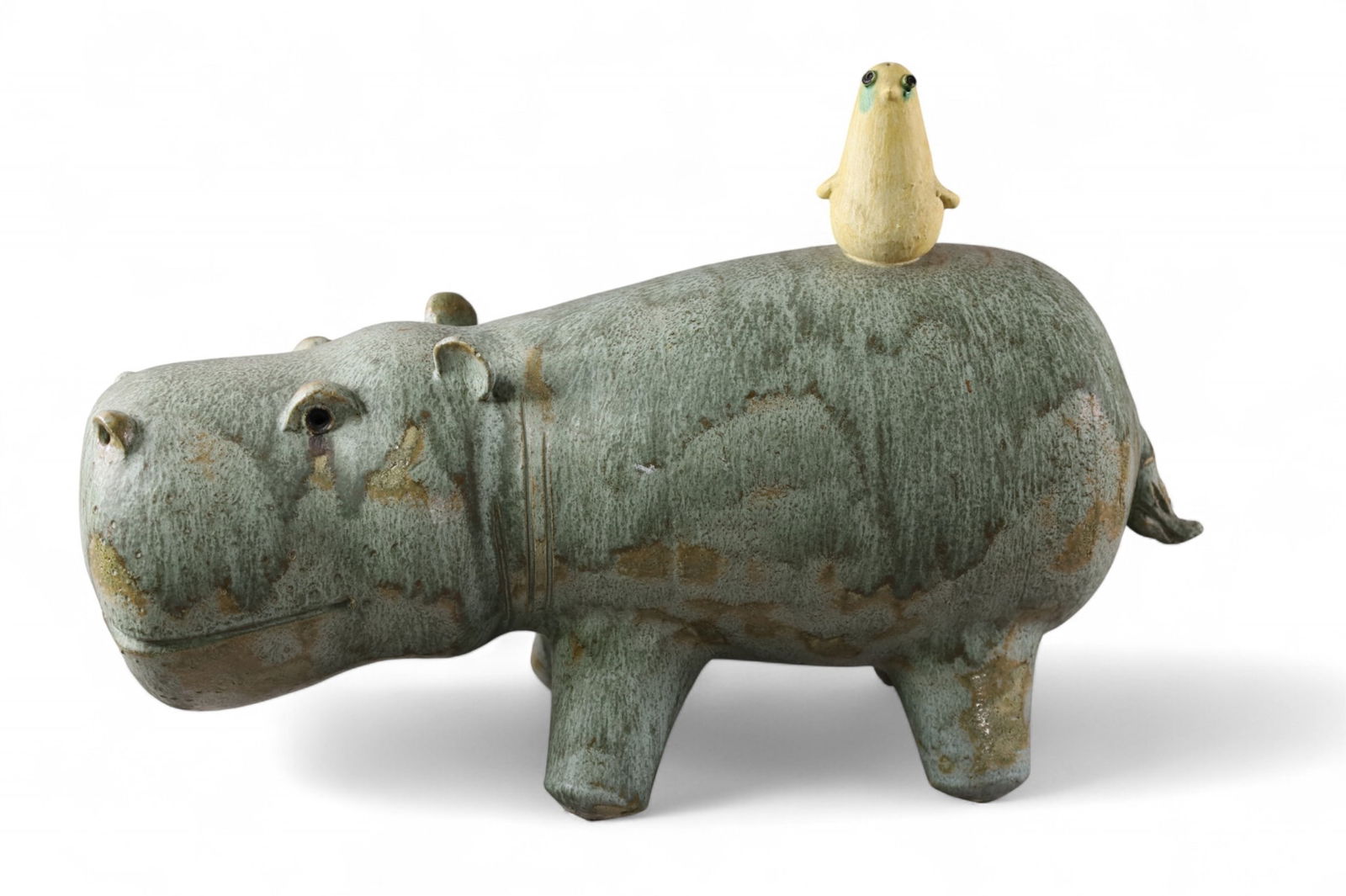 DAVID GIL STYLE CERAMIC HIPPO: LARGE HIPPO SCULPTURE, IN THE STYLE OF DAVID GIL. REPAIR TO TAIL. 21" L.