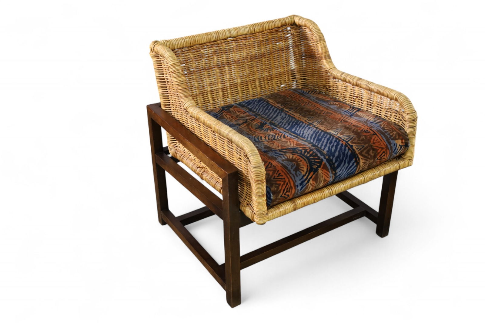 WICKER LOUNGE CHAIR: WALNUT BASE, AND WICKER AMRCHAIR, UNMARKED. 25" W x 25" D x 27" H. . THIS ITEM EXCEEDS SIZE LIMITATIONS FOR IN HOUSE SHIPPING, MUST BE PICKED UP IN HOUSE OR SHIPPED VIA 3rd PARTY GROUND SHIPPER.