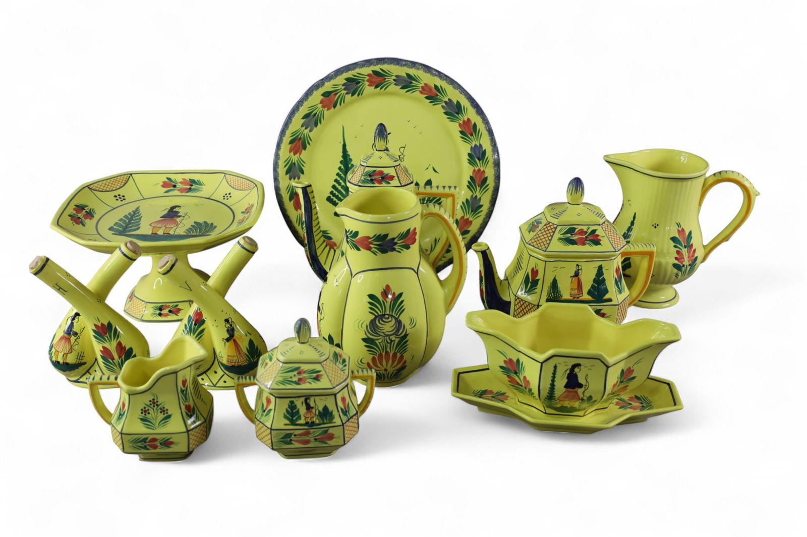 COLLECTION OF QUIMPER: 11 PIECES OF QUIMPER SOLEIL, TEA POT, COFFEE POT, CREAMER SUGAR AND MORE.