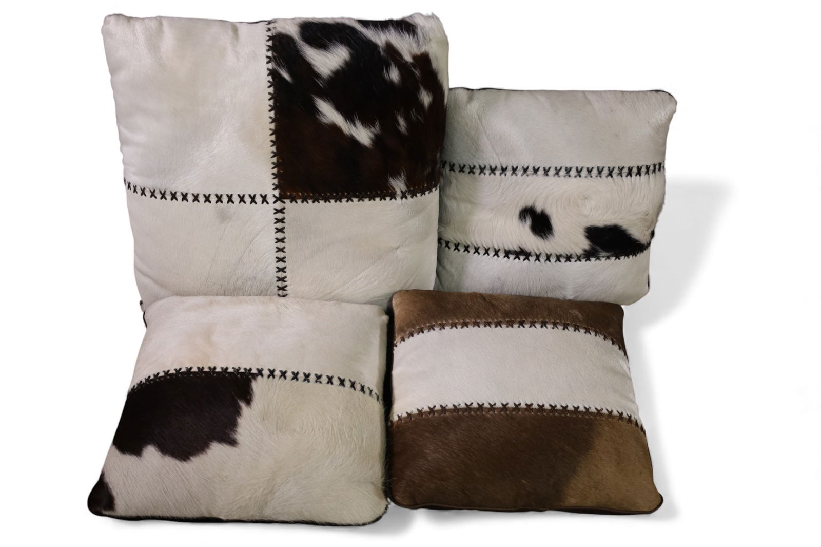 4 COWHIDE PILLOWS: 4 HIDE COVERED PILLOWS. 15" - 19" W
