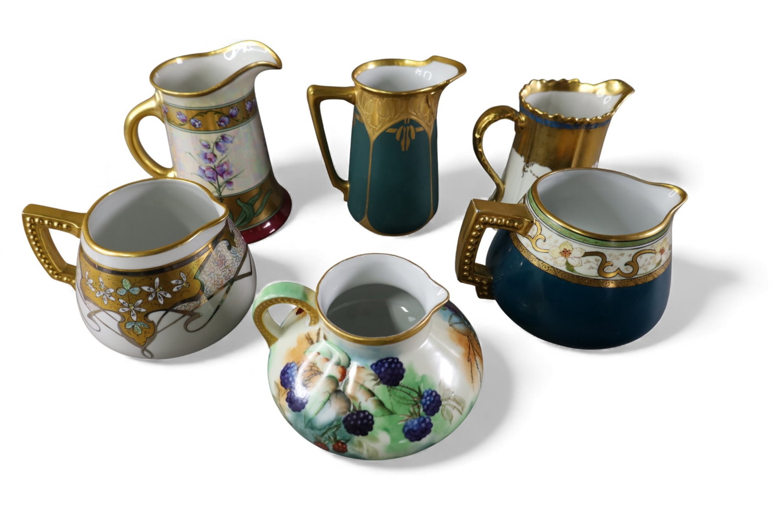 6 HAND PAINTED PORCELAIN PITCHERS: INCLUDING LIMOGES, LUKEN, BRAUER, AND MORE. 5" - 8" H.