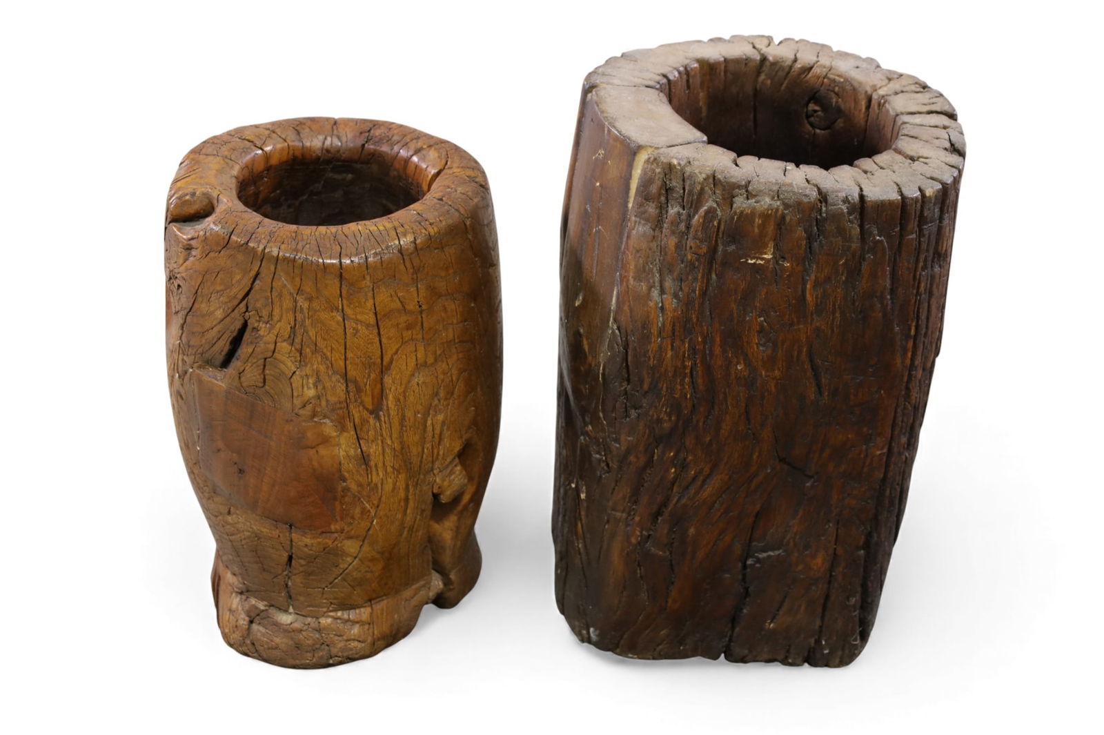 2 CARVED RICE POUNDERS: 2 LARGE CARVED WOOD RICE POUNDERS. 12" DIAM x 18" & 24" H. THIS ITEM EXCEEDS SIZE LIMITATIONS FOR IN HOUSE SHIPPING, IT MUST BE PICKED UP IN HOUSE OR SHIPPED VIA 3rd PARTY GROUND SHIPPER.