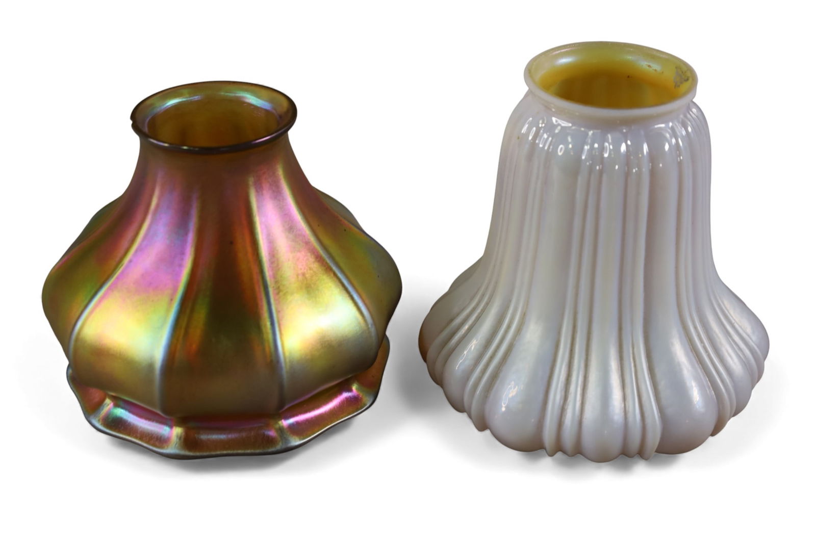 2 ART GLASS SHADES: 2 ART GLASS LAMP SHADES, ONE SIGNED STEUBEN. GOLD HAS CHIP TO FITTER. 4" L & 2" FITTER