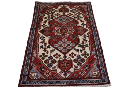 APPROX 5' 3" x 3' 10" HANDMADE WOOL RUG