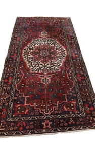 APPROX 5' x 9' 10" HANDMADE WOOL RUG