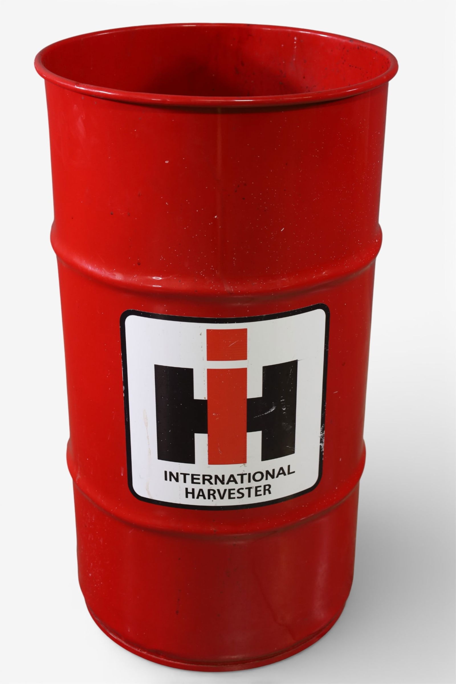 INTERNATIONAL HARVESTER TRASH CAN: INTERNATIONAL HARVESTER TRASH CAN BARREL. 14" DIAM x 27" H. THIS ITEM EXCEEDS SIZE LIMITATIONS FOR IN HOUSE SHIPPING, IT MUST BE PICKED UP IN HOUSE OR SHIPPED VIA 3rd PARTY GROUND SHIPPER.