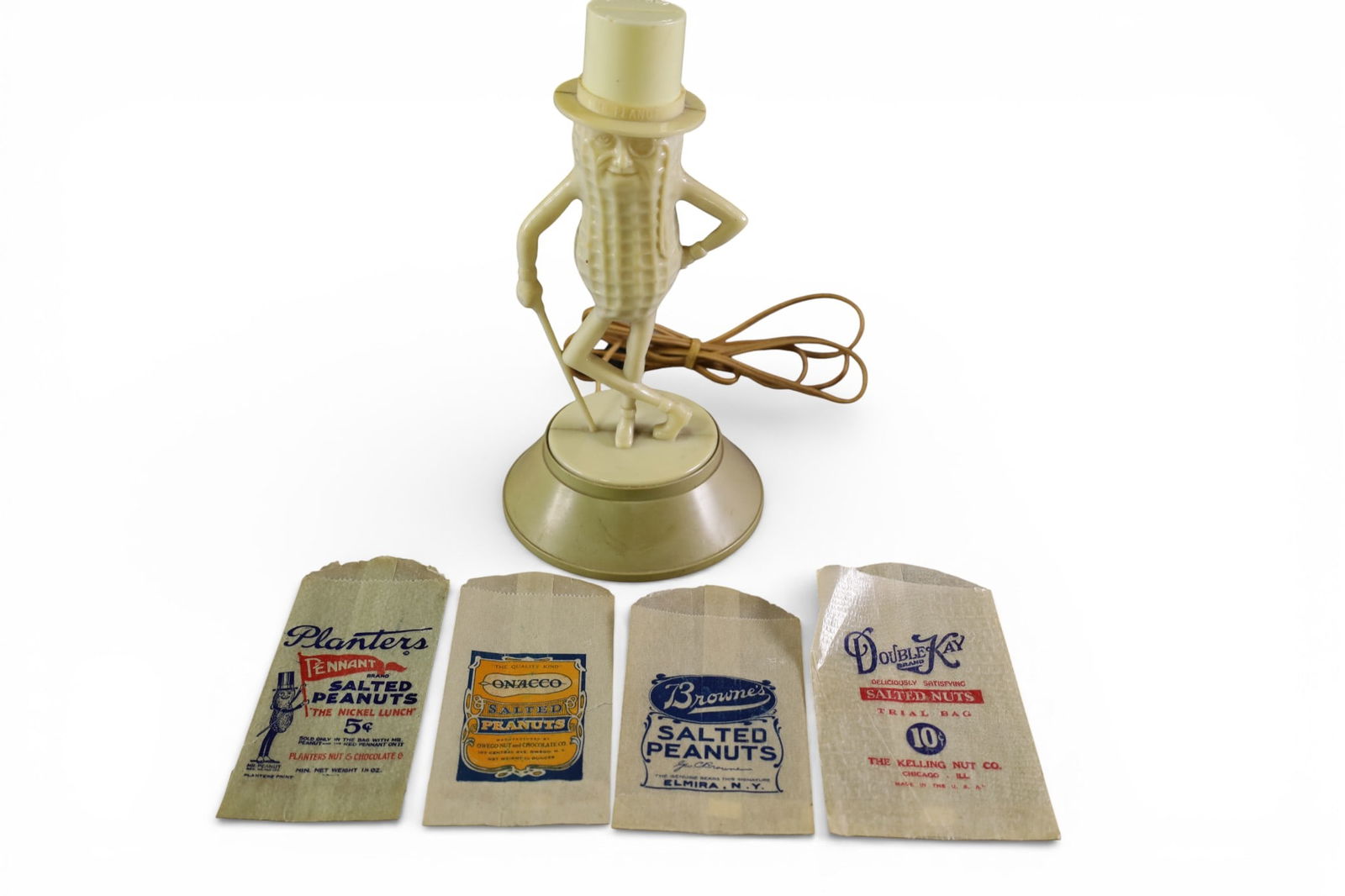 PLANTERS PEANUTS LAMP: PLANTERS PEANUT PLASTIC LAMP WITH ADVERTISING BAGS. 10" H.