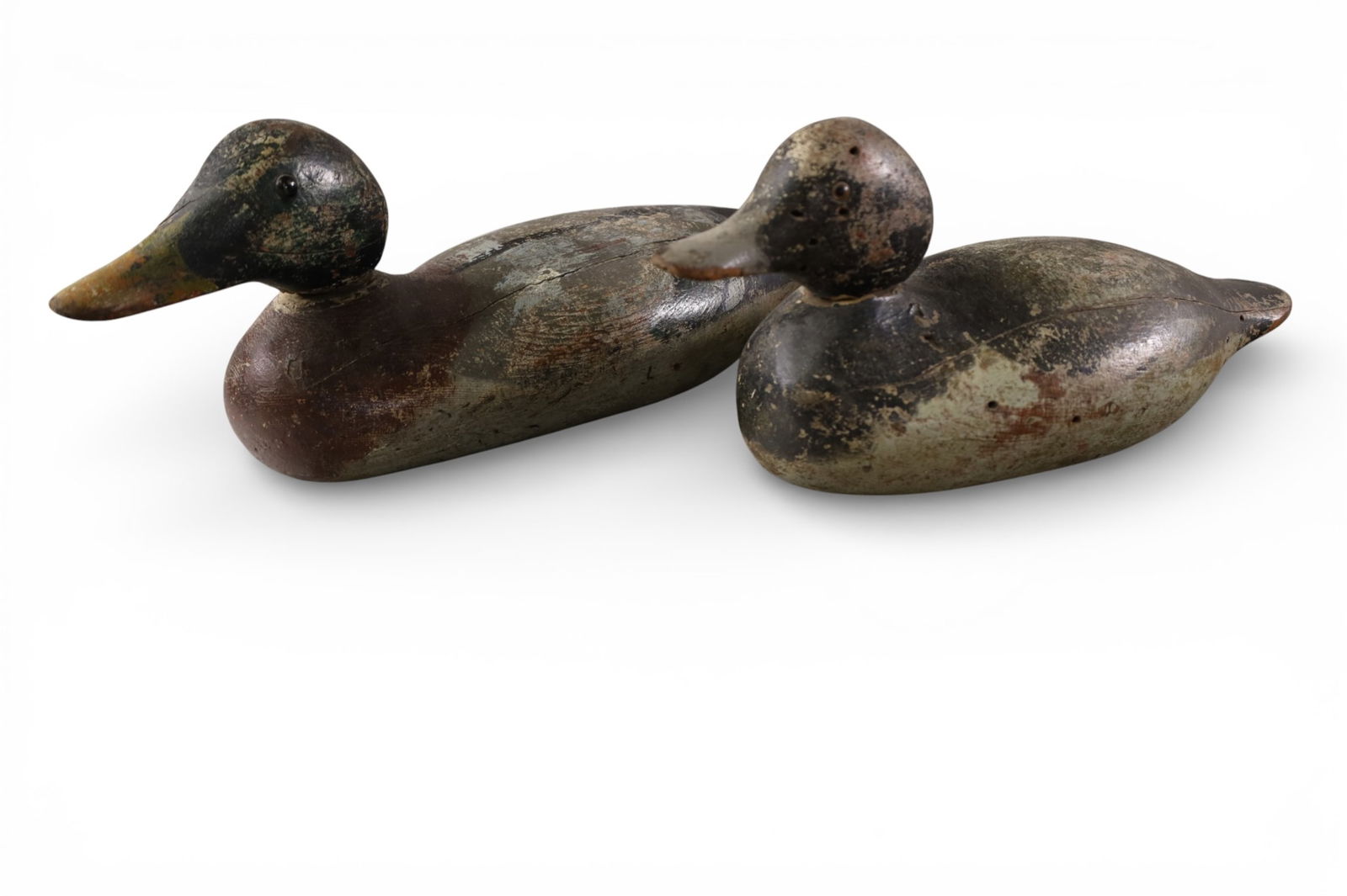 2 DUCK DECOYS: WOODEN CARVED DUCK DECOYS, RETAIN SOME ORIGINAL PAINT. 16" & 13" L.