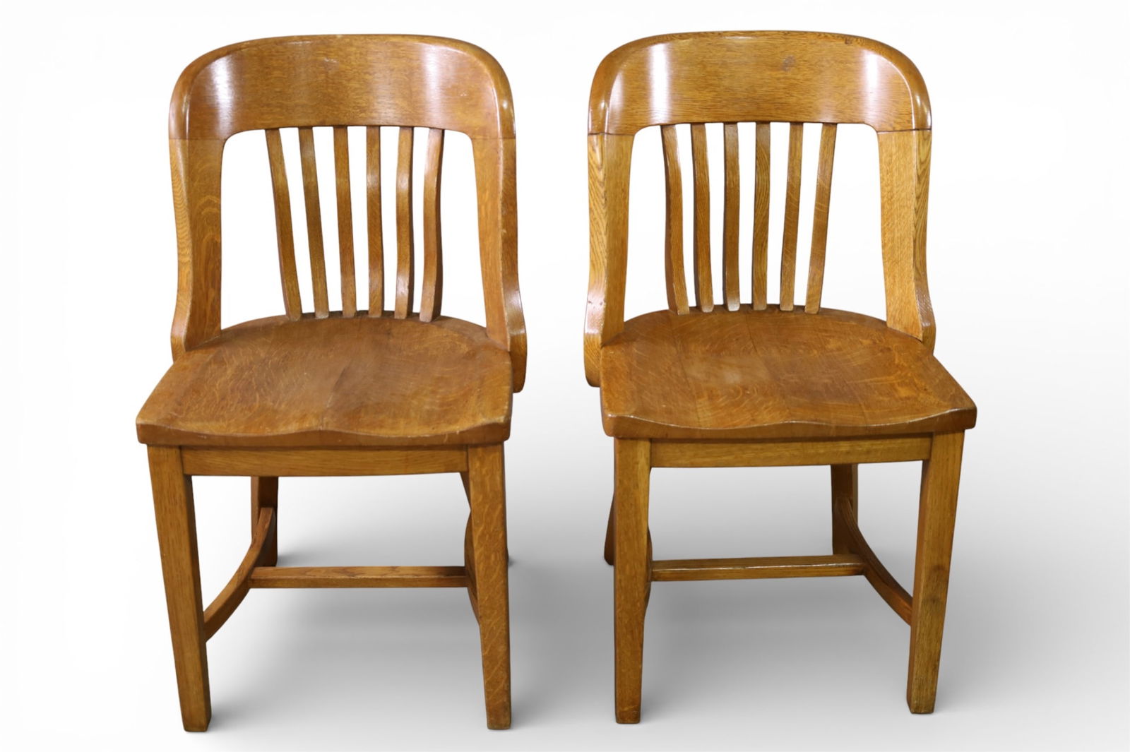 PAIR OF ANTIQUE OAK CHAIRS: PAIR OF OAK OFFICE CHAIRS, 18" W x 17" D x 33" H. THIS ITEM EXCEEDS SIZE LIMITATIONS FOR IN HOUSE SHIPPING, IT MUST BE PICKED UP IN HOUSE OR SHIPPED VIA 3rd PARTY GROUND SHIPPER.