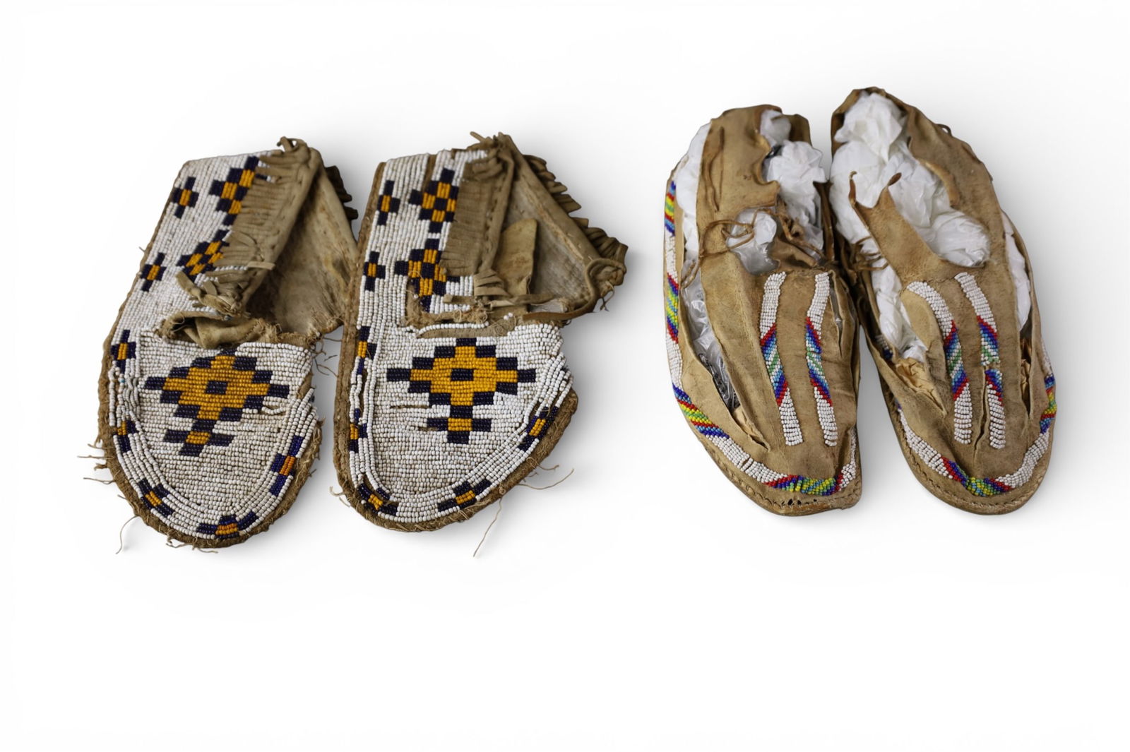 2 PAIRS OF MOCCASINS: 2 PAIRS OF HANDMADE NATIVE AMERICAN MOCCASINS, SOLE IS GONE ON ONE PAIR.