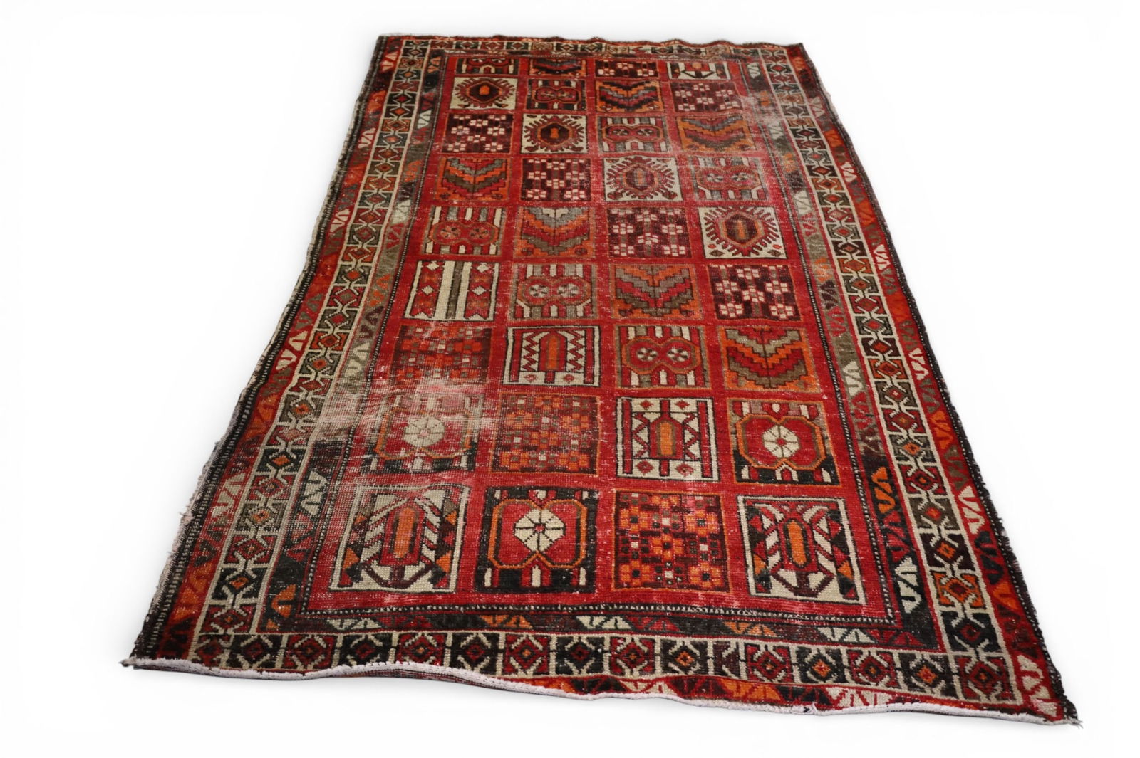 APPROX 4' 6" x 8' 2" HANDMADE WOOL RUG: HANDMADE WOOL RUG, AREAS OF LOW PILE, AND EDGE WEAR.