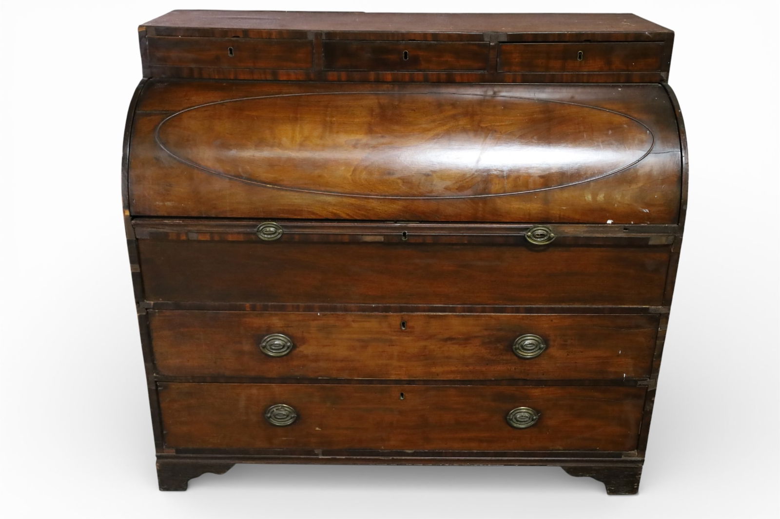 CYLINDER ROLL DESK: 19TH CENTURY MAHOGANY ENGLISH CYLINDER ROLL DESK, THREE UPPER DRAWERS, MISSING MOULDING, VENEER DAMAGE. ROLL NEEDS ADJUSTMENT, DOES NOT OPEN EASILY. 48" W x 22" D x 44" H. THIS ITEM EXCEEDS SIZE LIMIT