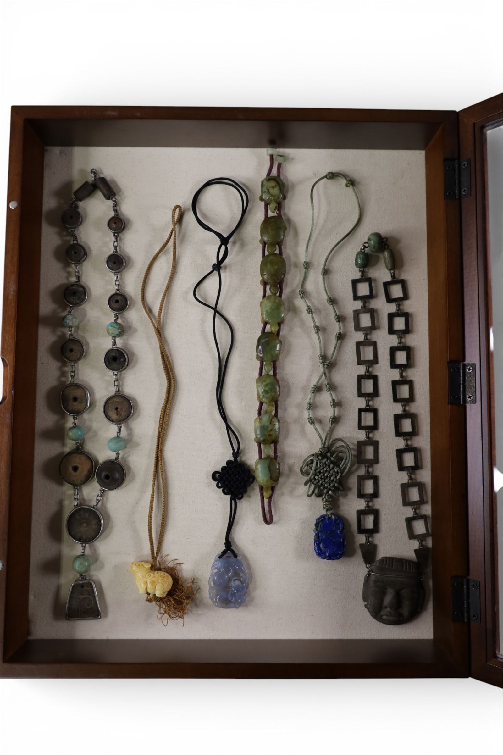 GROUPING OF CHINESE NECKALCES: INCLUDING JADE & LAPIS. SHOWCASE NOT INCLUDED.