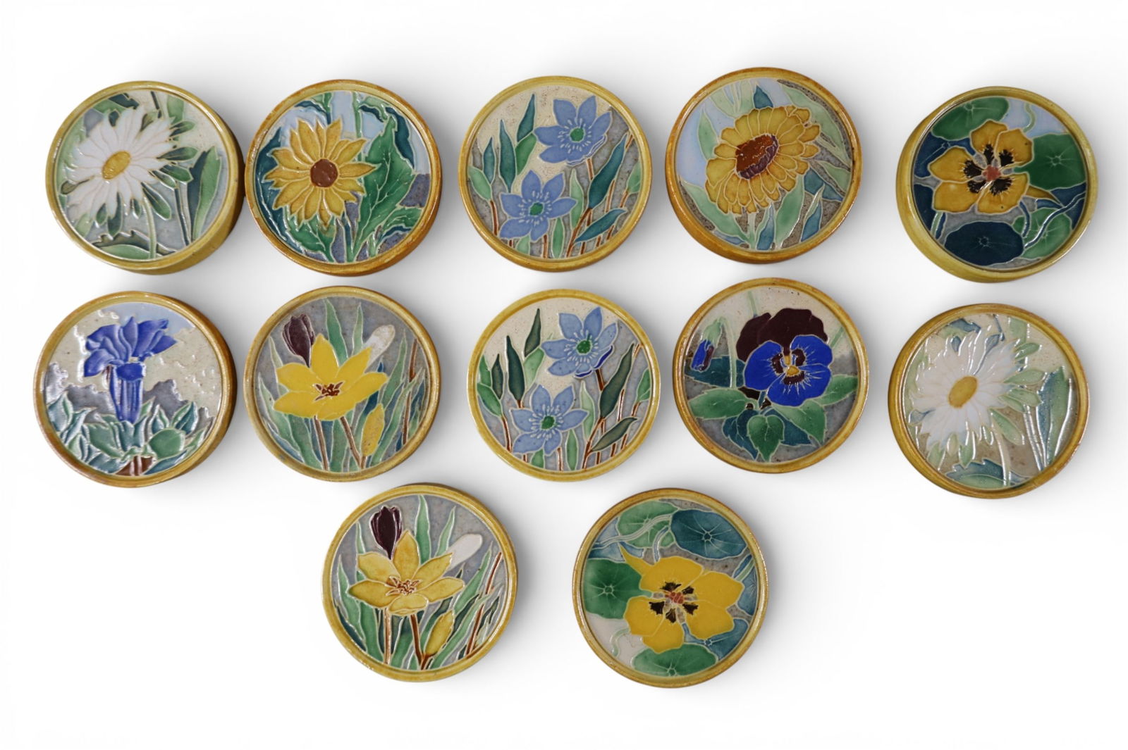 12 WESTRAVEN TILES: SMALL CIRCULAR TILES, FLORAL MOTIF. 3" DIAM.
