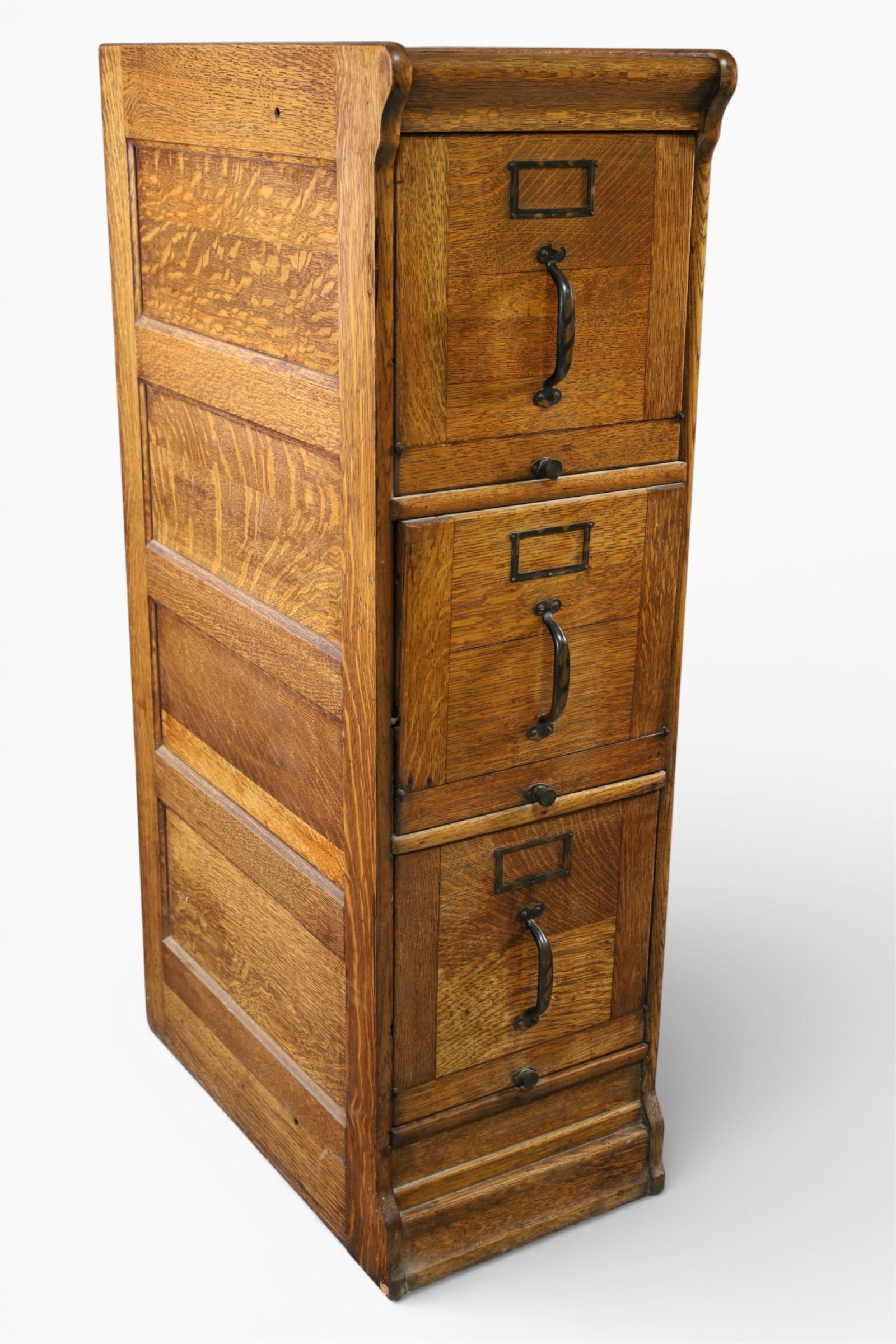 1900'S AM. OAK FILE CABINET: PANELED SIDES, THREE DRAWER FILE WITH DROP FRONT DRAWERS. 14 1/2" W x 25" D x 48 1/2" H. THIS ITEM EXCEEDS SIZE LIMITATIONS FOR IN HOUSE SHIPPING, IT MUST BE PICKED UP IN HOUSE OR SHIPPED VIA 3rd PART