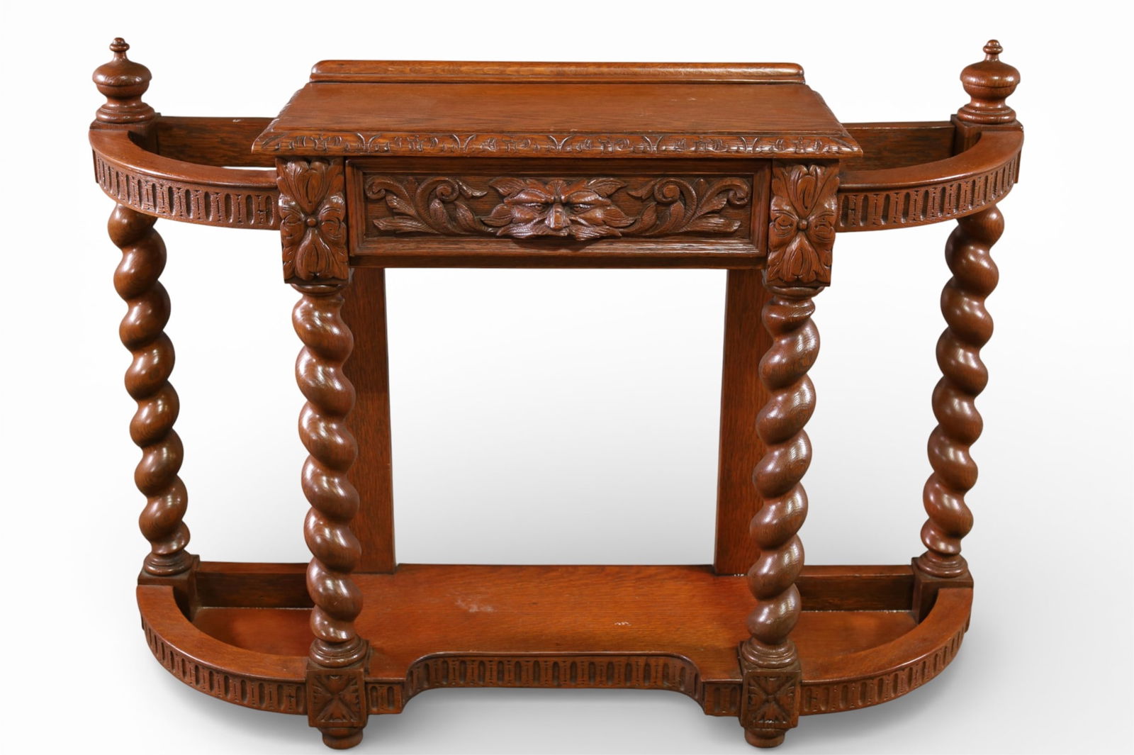 OAK UMBRELLA STAND: SINGLE DRAWER OAK ENTRY WAY UMBRELLA STAND, LION CARVED BARLEY TWIST. 41 1/2" W x 11" D x 31" H. THIS ITEM EXCEEDS SIZE LIMITATIONS FOR IN HOUSE SHIPPING, IT MUST BE PICKED UP IN HOUSE OR SHIPPED VIA