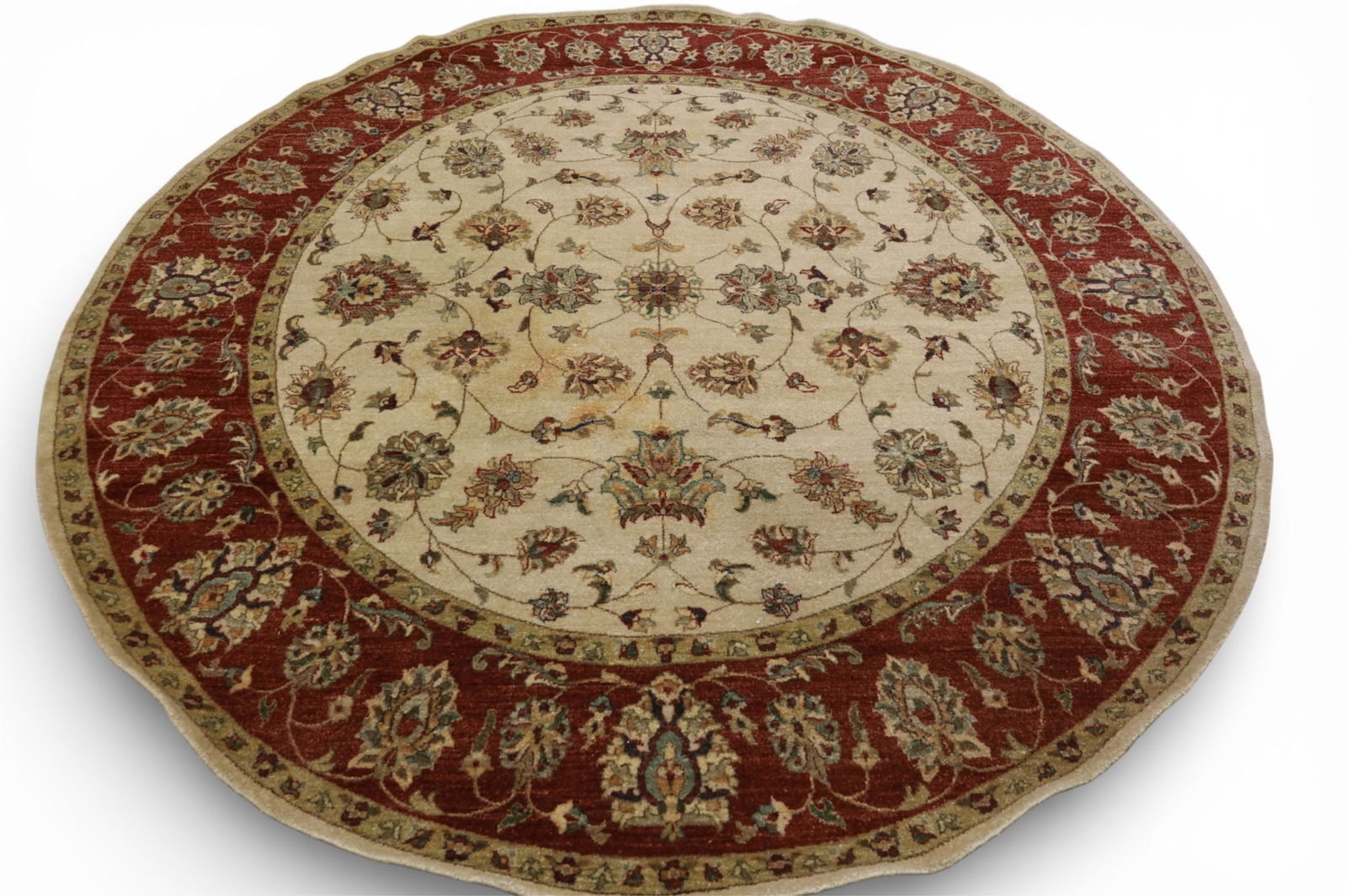 APPROX 8' 1" ROUND WOOL RUG: ROUND WOOL RUG. SOME STAINS.