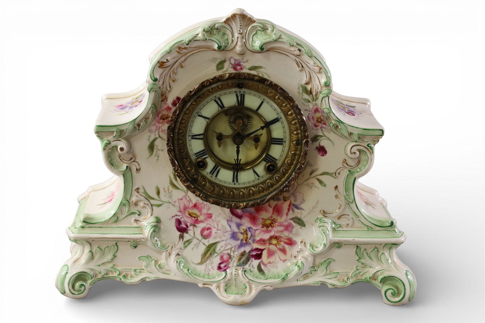 PORCELAIN MANTLE CLOCK: ROYAL BONN PORCELAIN MANTLE CLOCK, ANSONIA. ALL CLOCKS ARE SOLD AS IS WE DO NOT GUARANTEE WORKING ORDER. 14" W x 11" H.