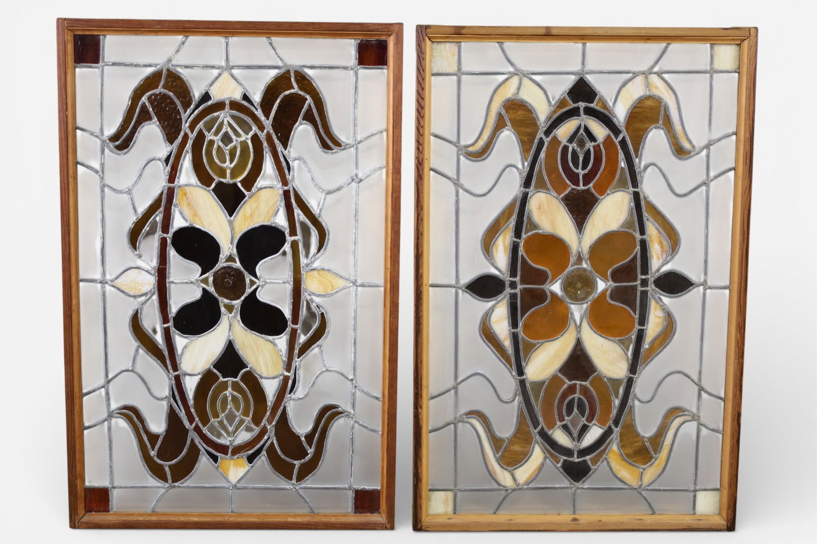 PAIR OF STAINED GLASS WINDOWS: PAIR OF FRAMED STAINED GLASS WINDOWS, SOME CRACKS TO PANELS. 25 1/2" x 40" THIS ITEM EXCEEDS SIZE LIMITATIONS FOR IN HOUSE SHIPPING, IT MUST BE PICKED UP IN HOUSE OR SHIPPED VIA 3rd PARTY GROUND SHIPP