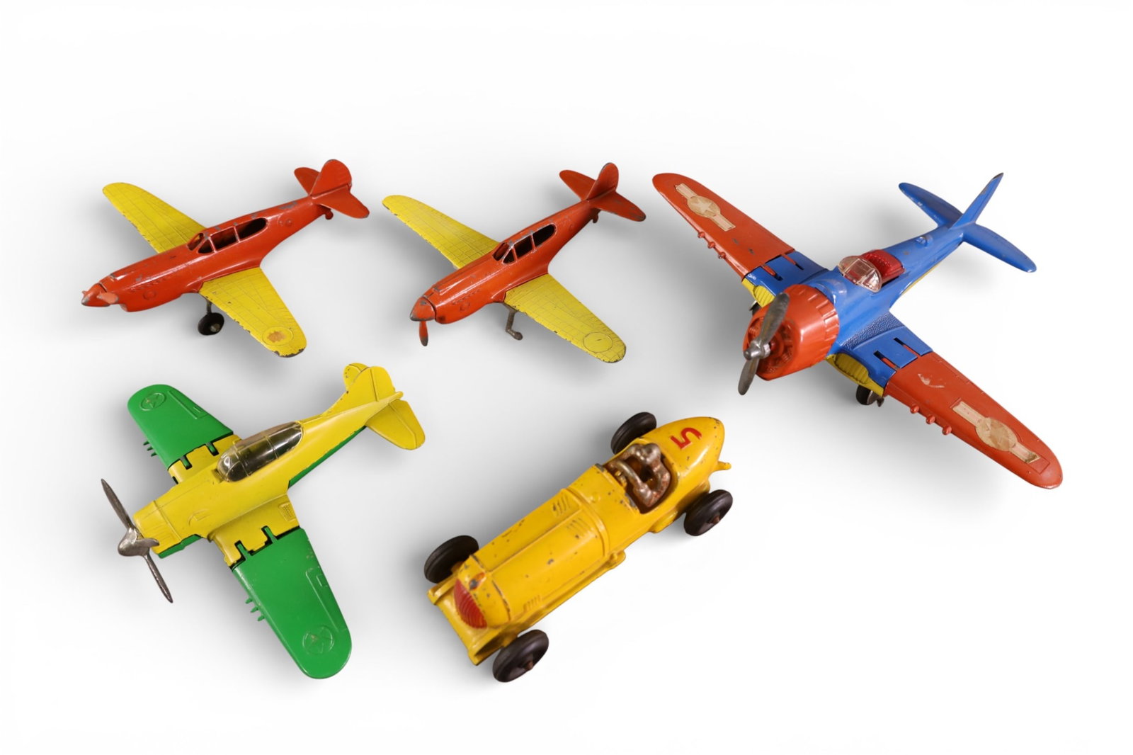 5 HUBLEY TOYS: AIRPLANES & RACER. MISSING ONE PROP & TIRES ON ONE.