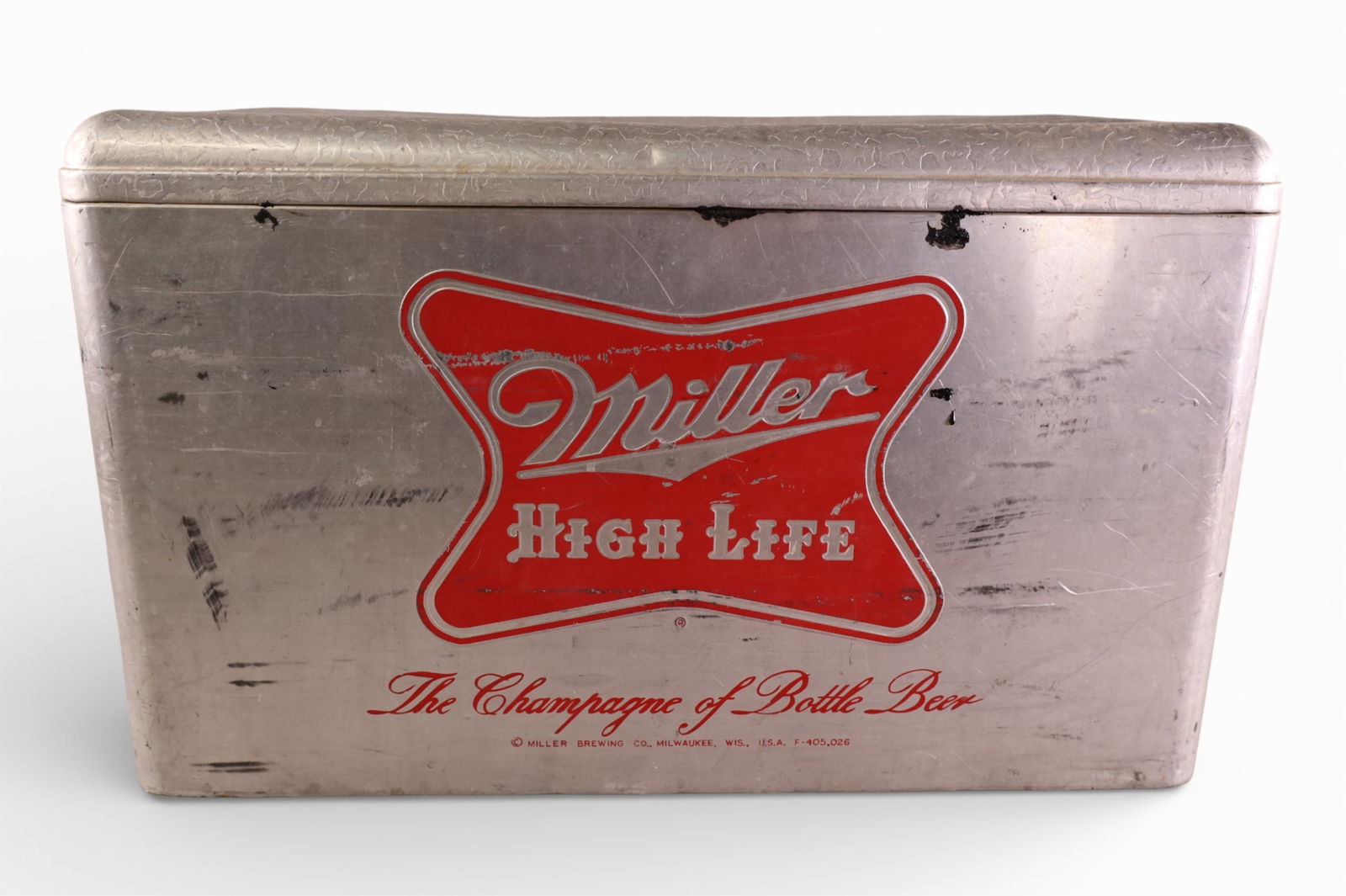 MILLER HIGH LIFE METAL COOLER: VINTAGE MILLER HIGH LIFE BEER COOLER, DENTS AND SCRATCHES. 22" W x 13" D x 13" H. THIS ITEM EXCEEDS SIZE LIMITATIONS FOR IN HOUSE SHIPPING, IT MUST BE PICKED UP IN HOUSE OR SHIPPED VIA 3rd PARTY GROUN
