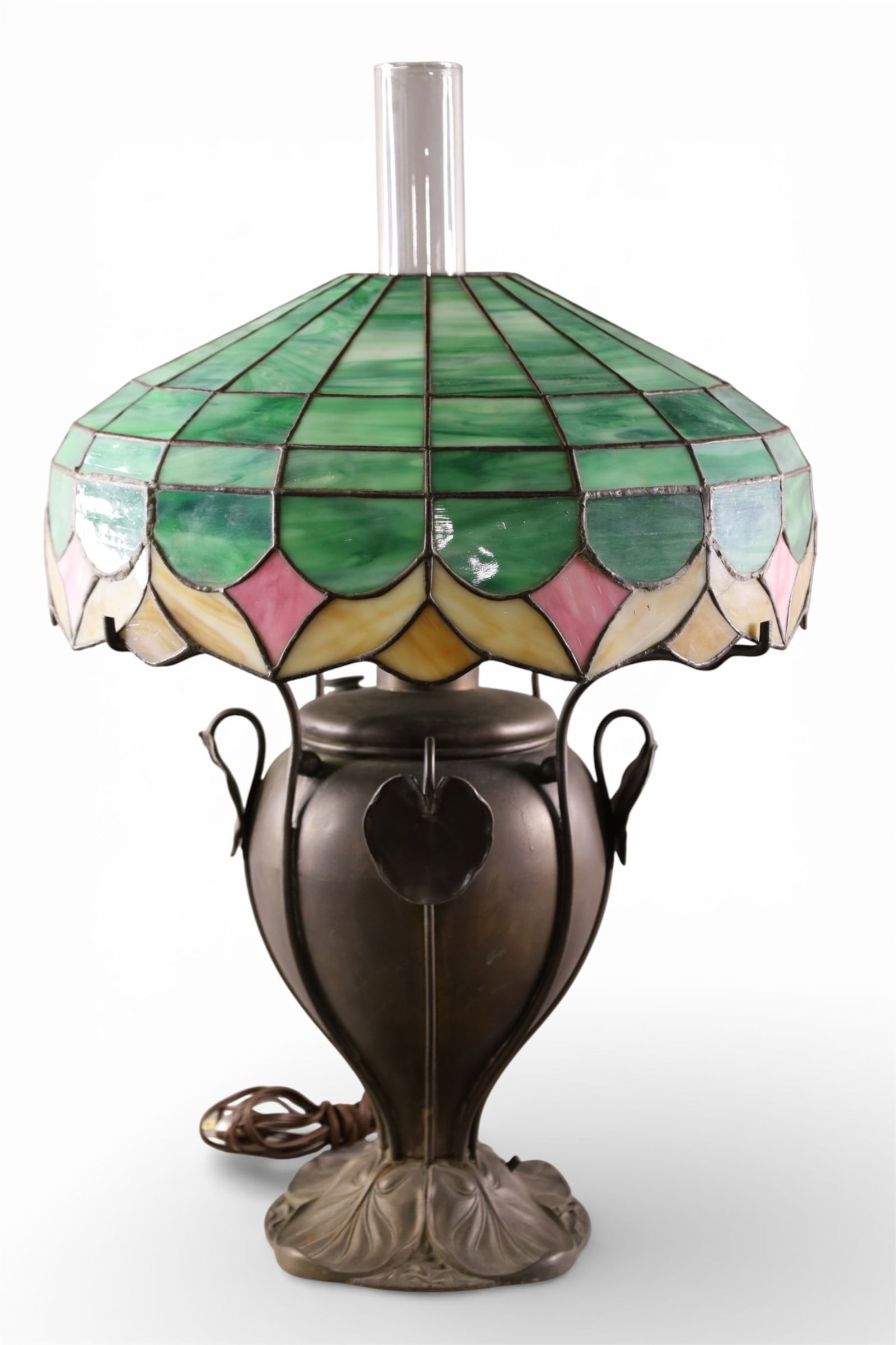 SLAG GLASS TABLE LAMP: CONVERTED OIL LAMP, SLAG GLASS TABLE LAMP, BASE IS MARKED BRADLEY & HUBBARD. SOME CRACKS TO PANELS. 26 1/2" H.