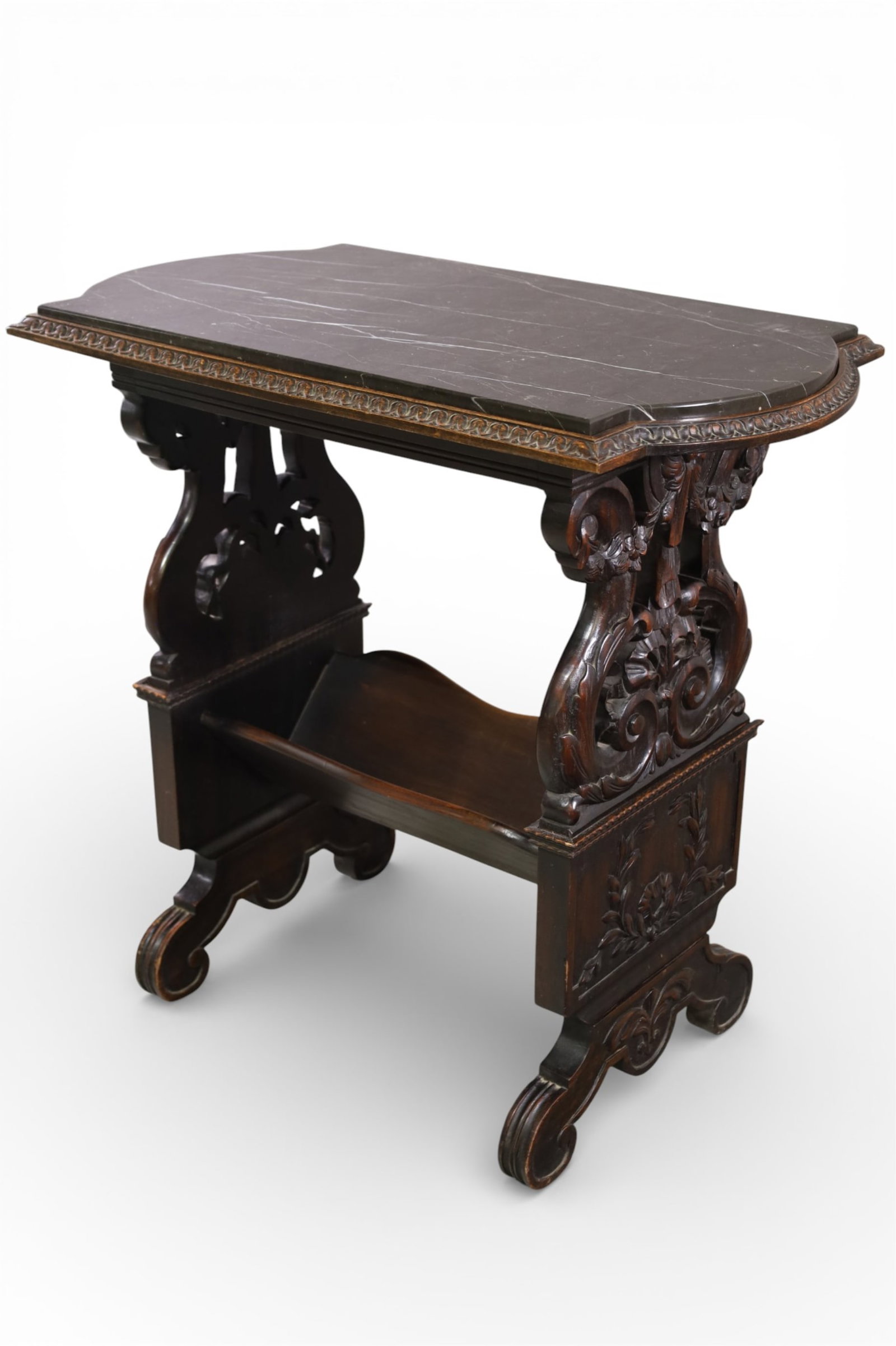 1920'S HIGHLY CARVED MARBLE TOP SIDE TABLE: BOOKCASE BOTTOM, HIGHLY CARVED MARBLE TOP END OR SIDE TABLE. MISSING 1 PIECE OF TRIM. 31" W x 19" D x 30" H. THIS ITEM EXCEEDS SIZE LIMITATIONS FOR IN HOUSE SHIPPING, MUST BE PICKED UP IN HOUSE OR SHI