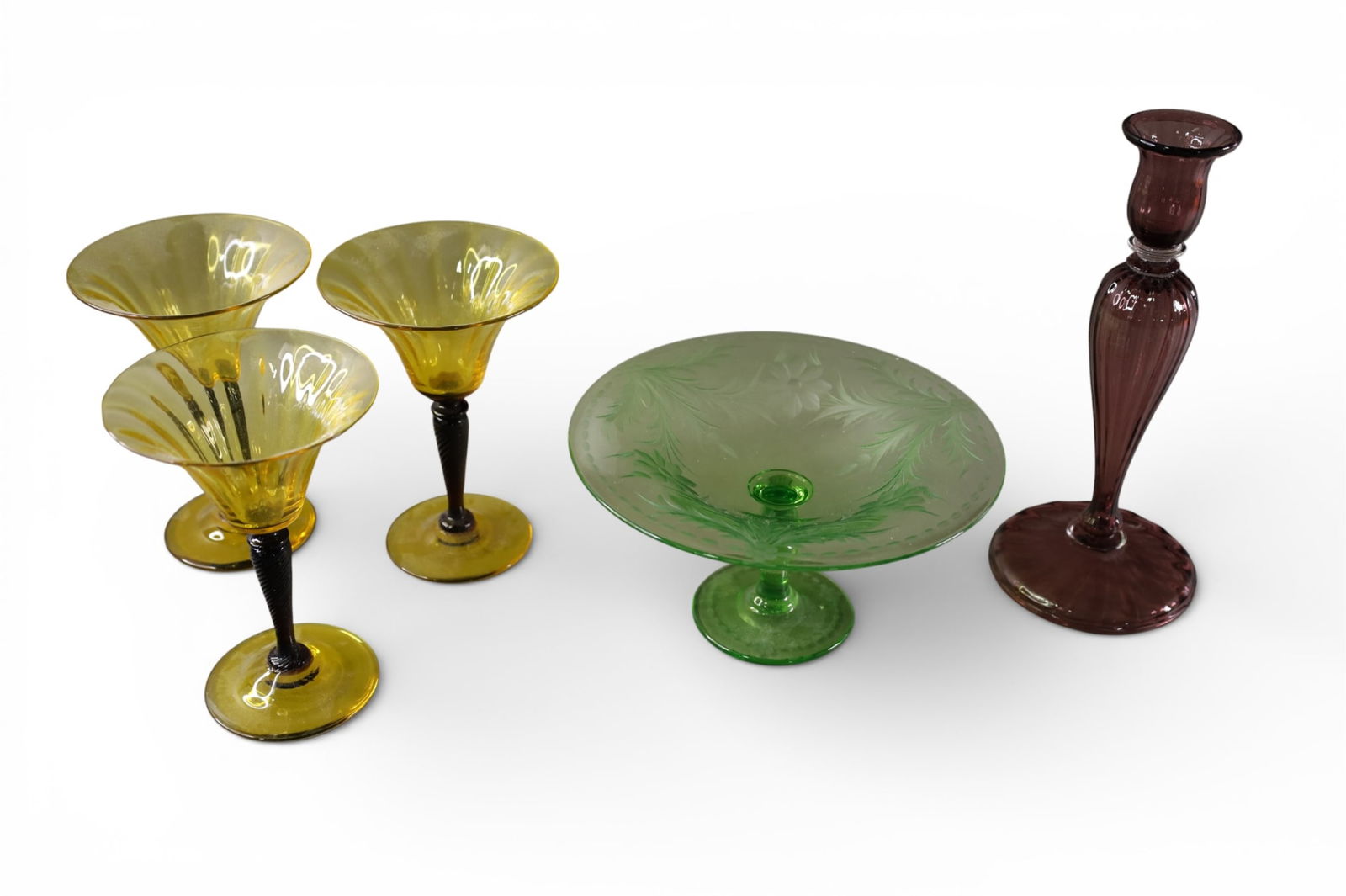 5 PIECES OF STEUBEN: GREEN ETCHED COMPOTE, (SIGNED), PURPLE CANDLESTICK & 3 STEMS. 4 1/2" - 10" H.