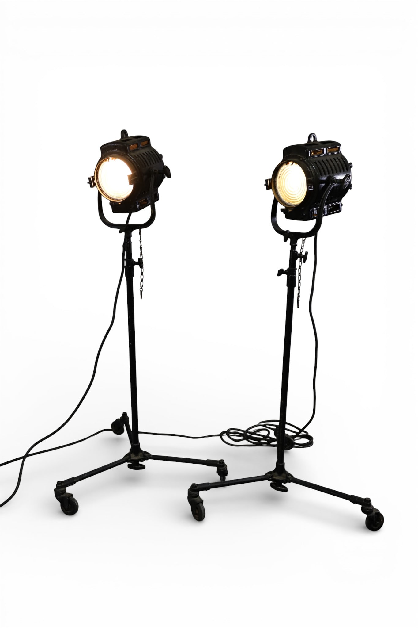 PAIR OF INDUSTRIAL STUDIO LIGHTS: PAIR OF INDUSTRIAL STUDIO LIGHTS, MARKED MOLE-RICHARDSON, HOLLYWOOD CA. ADJUSTABLE HEIGHT, 55" H. AS SHOWN. THIS ITEM EXCEEDS SIZE LIMITATIONS FOR IN HOUSE SHIPPING, MUST BE PICKED UP IN HOUSE