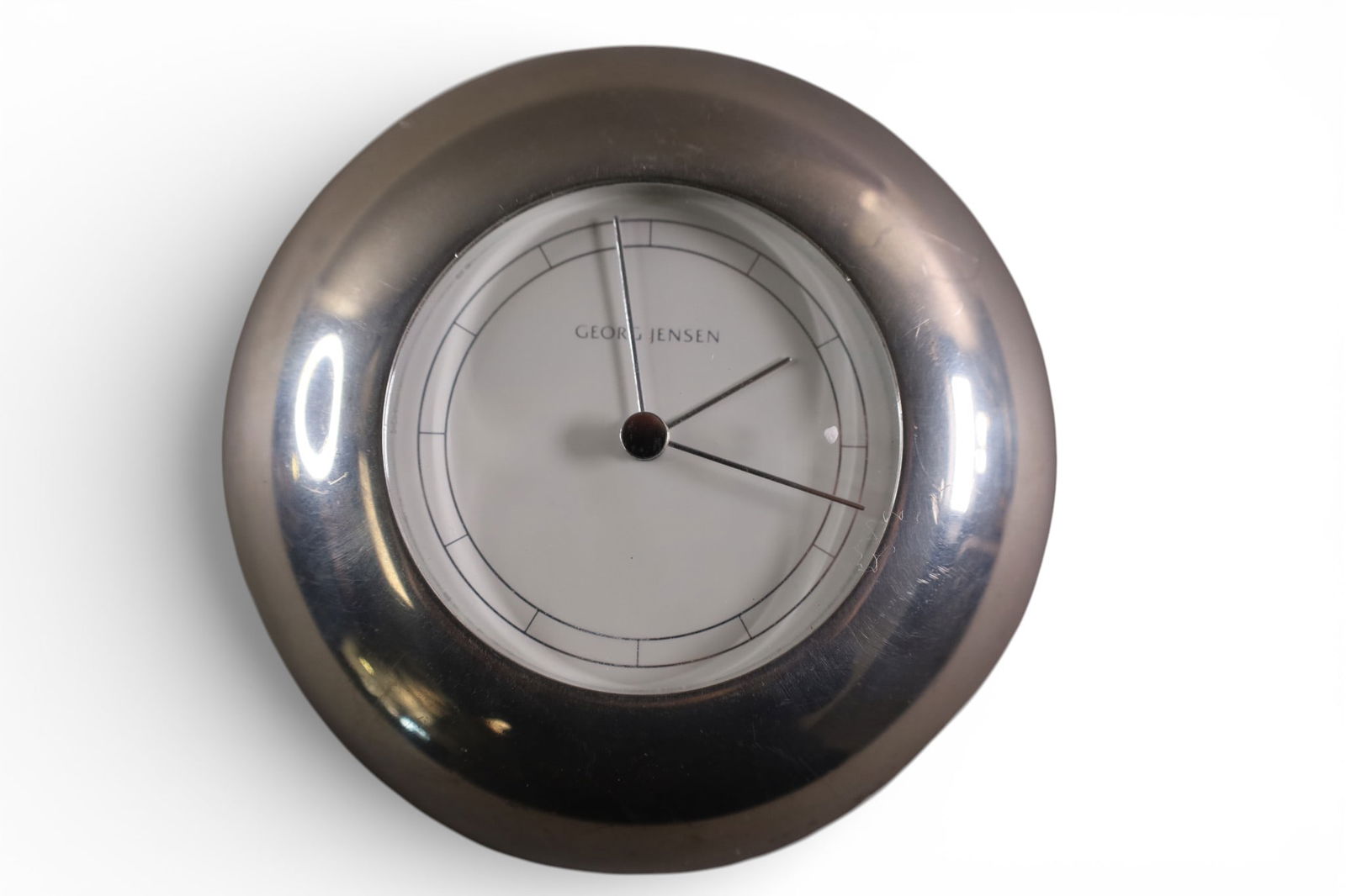 GEORG JENSEN CLOCK: QUARTZ MOVEMENT GEORG JENSEN CLOCK, 5 1/2" DIAM. ALL CLOCKS ARE SOLD AS IS WE DO NOT GUARANTEE WORKING ORDER.