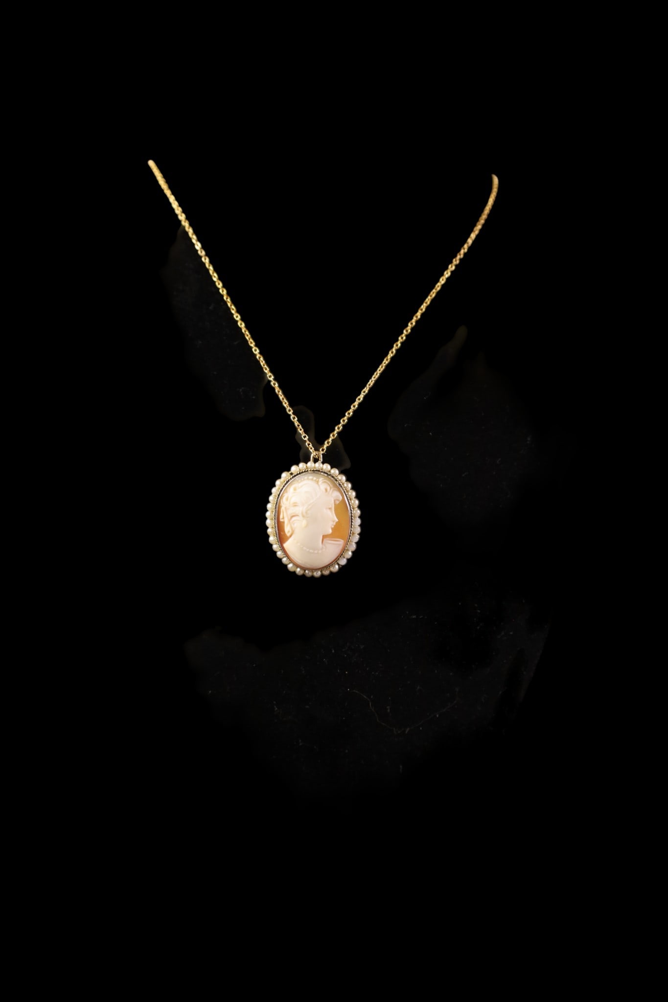 CAMEO PENDANT: MARKED 800 SILVER, CAMEO PENDANT WITH PEARL SURROUND. 1 1/4" H