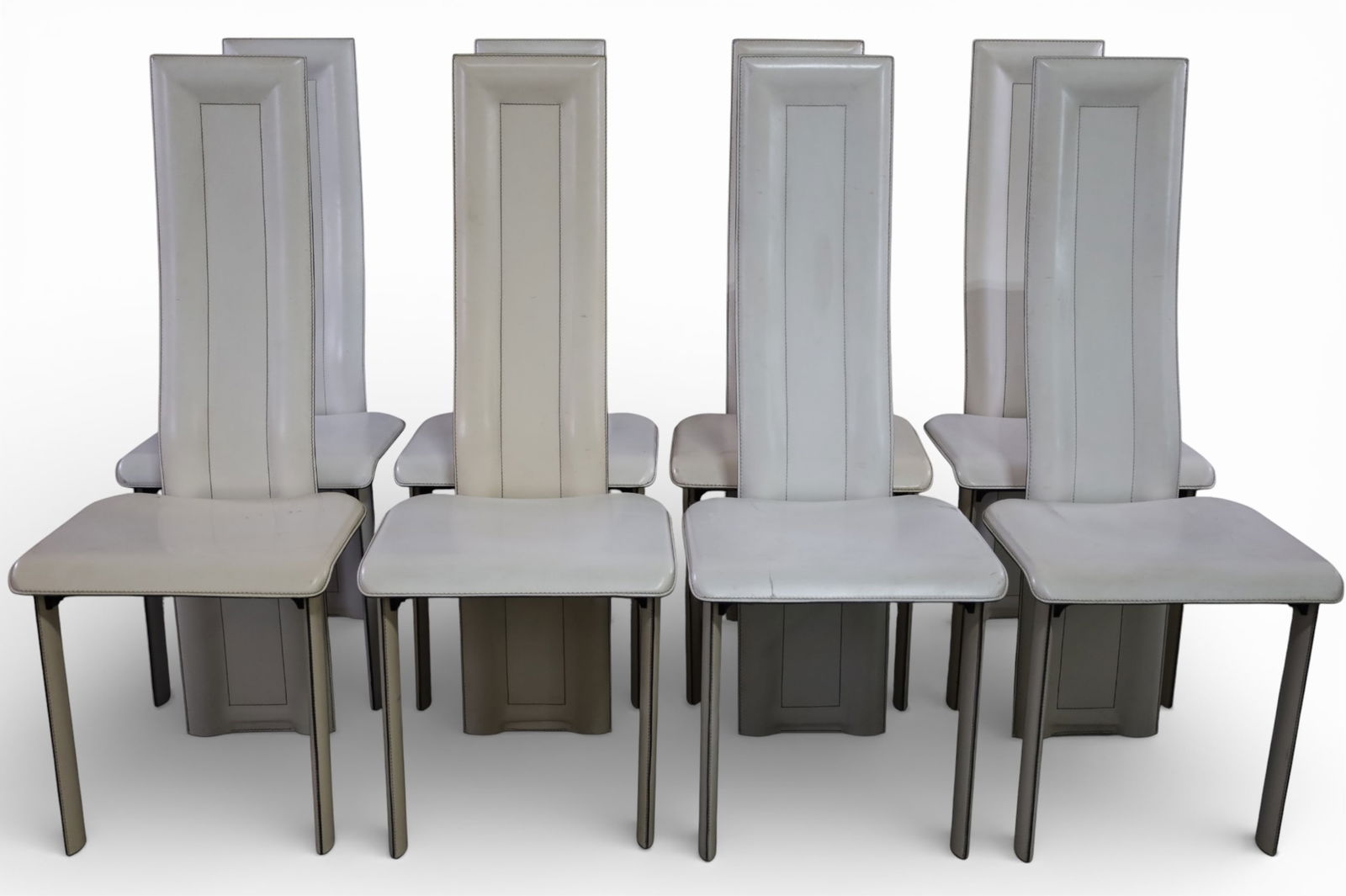 SET OF 8 ITALIAN LEATHER DINING CHAIRS: SET OF 8 TALL BACK ITALIAN LEATHER CHAIRS, MARKED YCAMI ITALY ON UNDERSIDE. MINOR WEAR TO SURFACE. 17" W x 18" D x 44" H. THIS ITEM EXCEEDS SIZE LIMITATIONS FOR IN HOUSE SHIPPING, MUST BE PICKED 