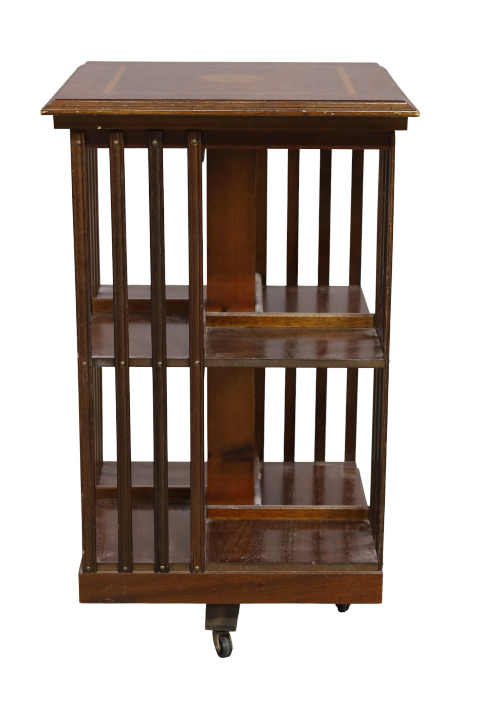 ANTIQUE REVOLVING BOOKCASE: MAHOGANY, INLAID TWO TIER REVOLVING BOOKCASE, MINOR WEAR TO FINISH. 18" x 18" x 30" H. THIS ITEM EXCEEDS SIZE LIMITATIONS FOR IN HOUSE SHIPPING, MUST BE PICKED UP IN HOUSE OR SHIPPED VIA 3rd