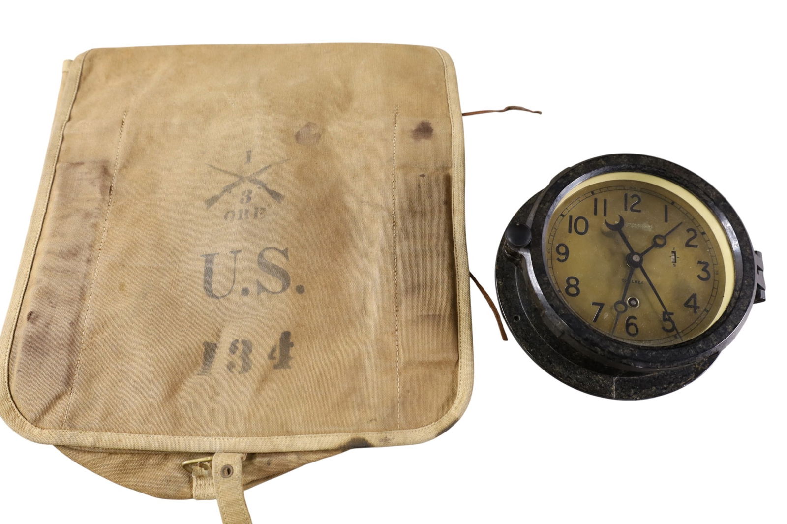 2 MILITARY ITEMS: CHELSEA SHIP'S CLOCK & US SPANISH AMERICAN WAR CANVAS BAG. 7 1/2" DIAM