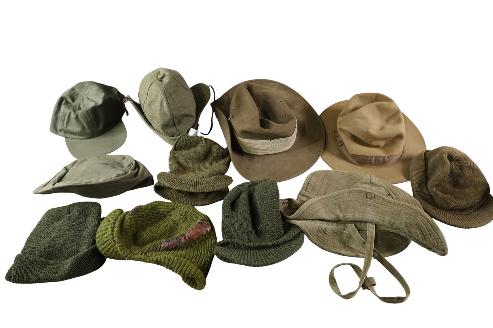 COLLECTION OF MILITARY HATS: CANVAS AND FELT MILITARY HATS.