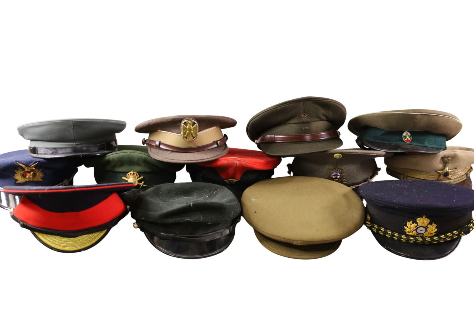 LARGE LOT OF FOREIGN MILITARY HATS: 13 TOTAL. INCLUDING SWEDISH, BRITISH, SPANISH, & MORE
