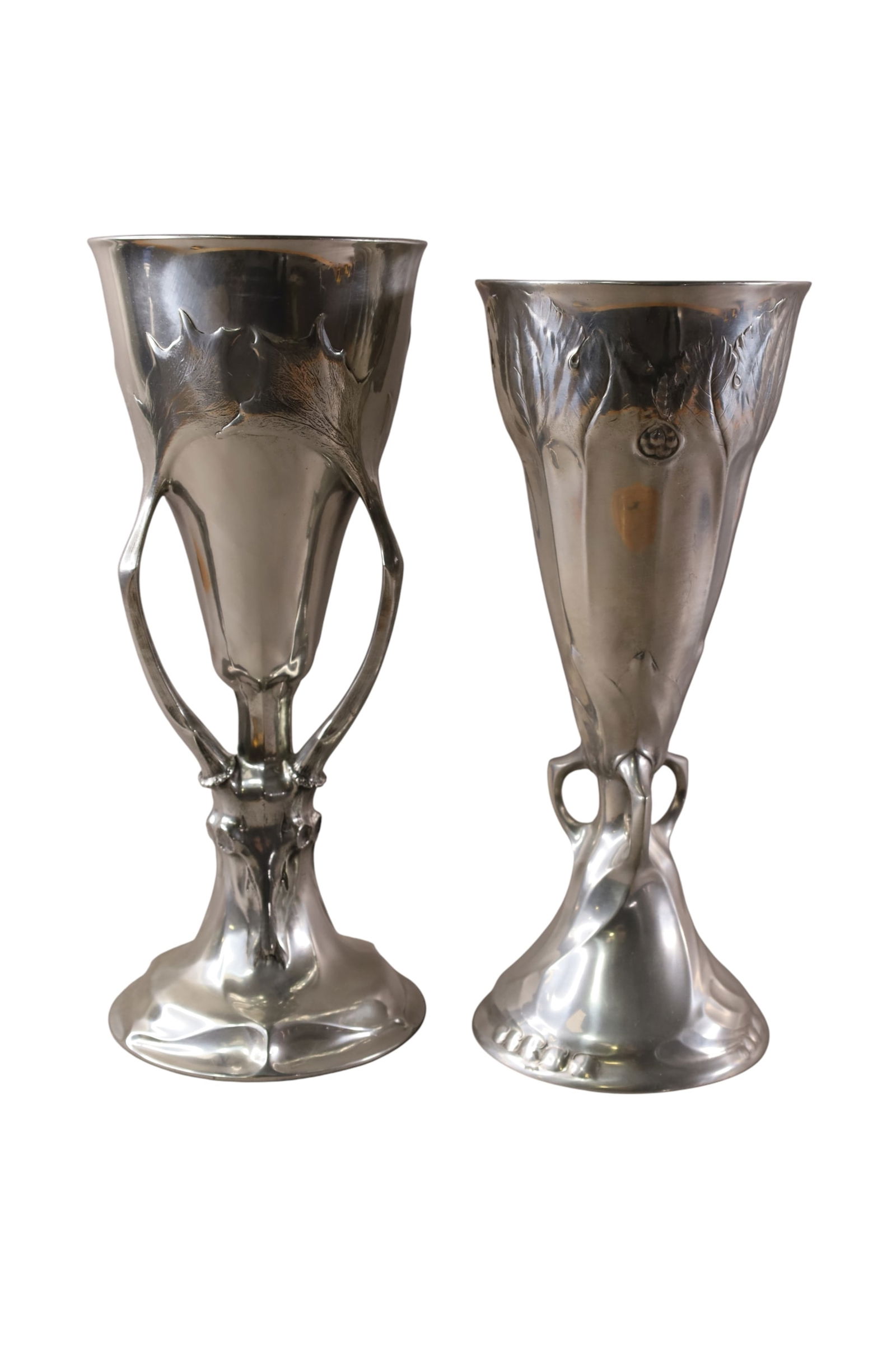 PAIR OF ART NOUVEAU PEWTER VASES: PAIR OF KAYSERZINN PEWTER VASES, ELK HEAD DECORATED TALL VASE MARKED 4800. LEAF FORM. MARKED 4445. 14" & 15" H.