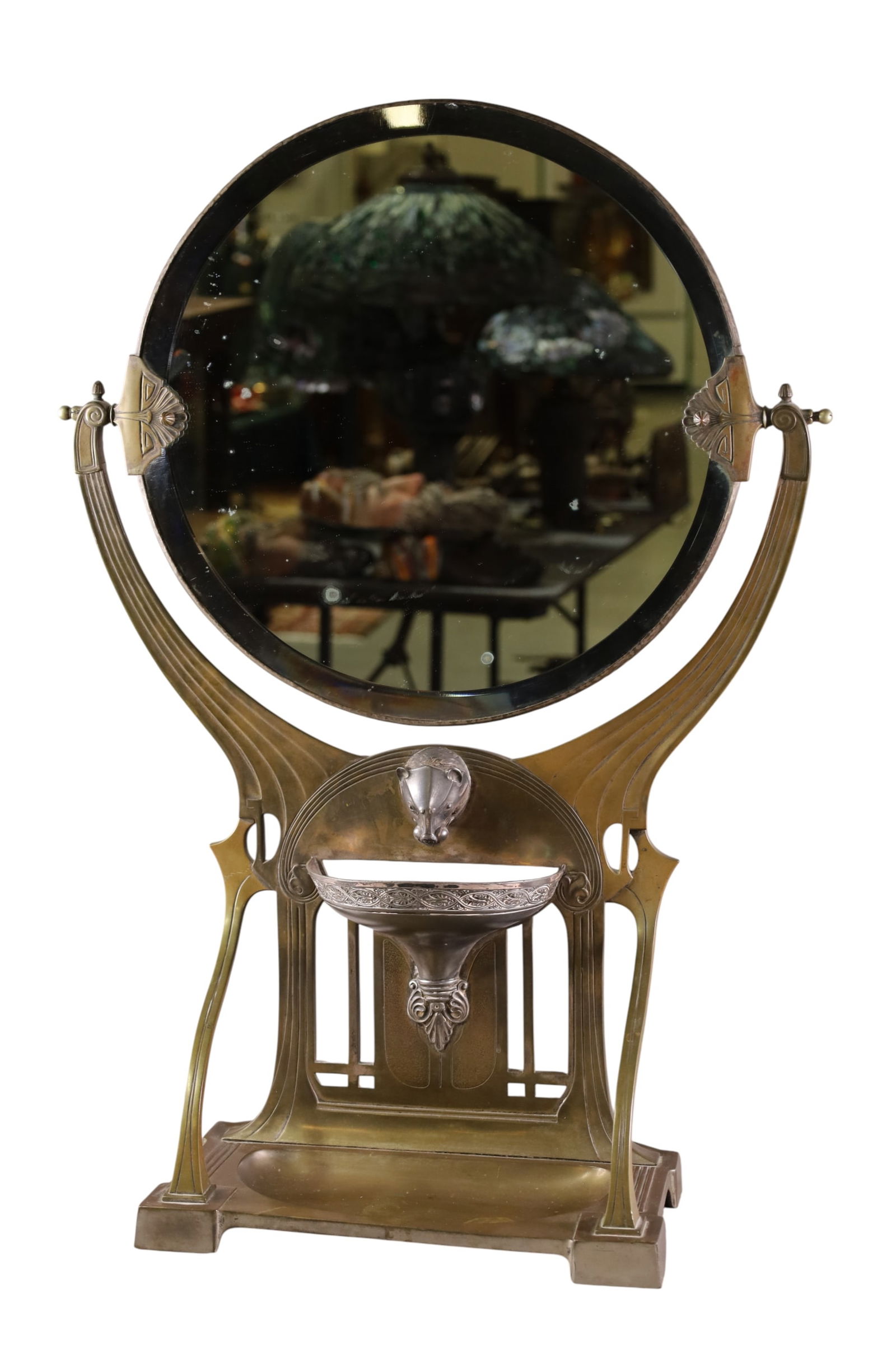 GERMAN JUGENDSTIL GRAND TABLE MIRROR: LARGE GERMAN JUGENDSTIL BRONZE VANITY TABLE MIRROR, ART NOUVEAU SWIVEL MIRROR WITH LOWER SILVER DECORATION. SOME SILVER LOSS TO MIRROR. 21" W X 30" H. THIS ITEM EXCEEDS SIZE LIMITATIONS FOR IN