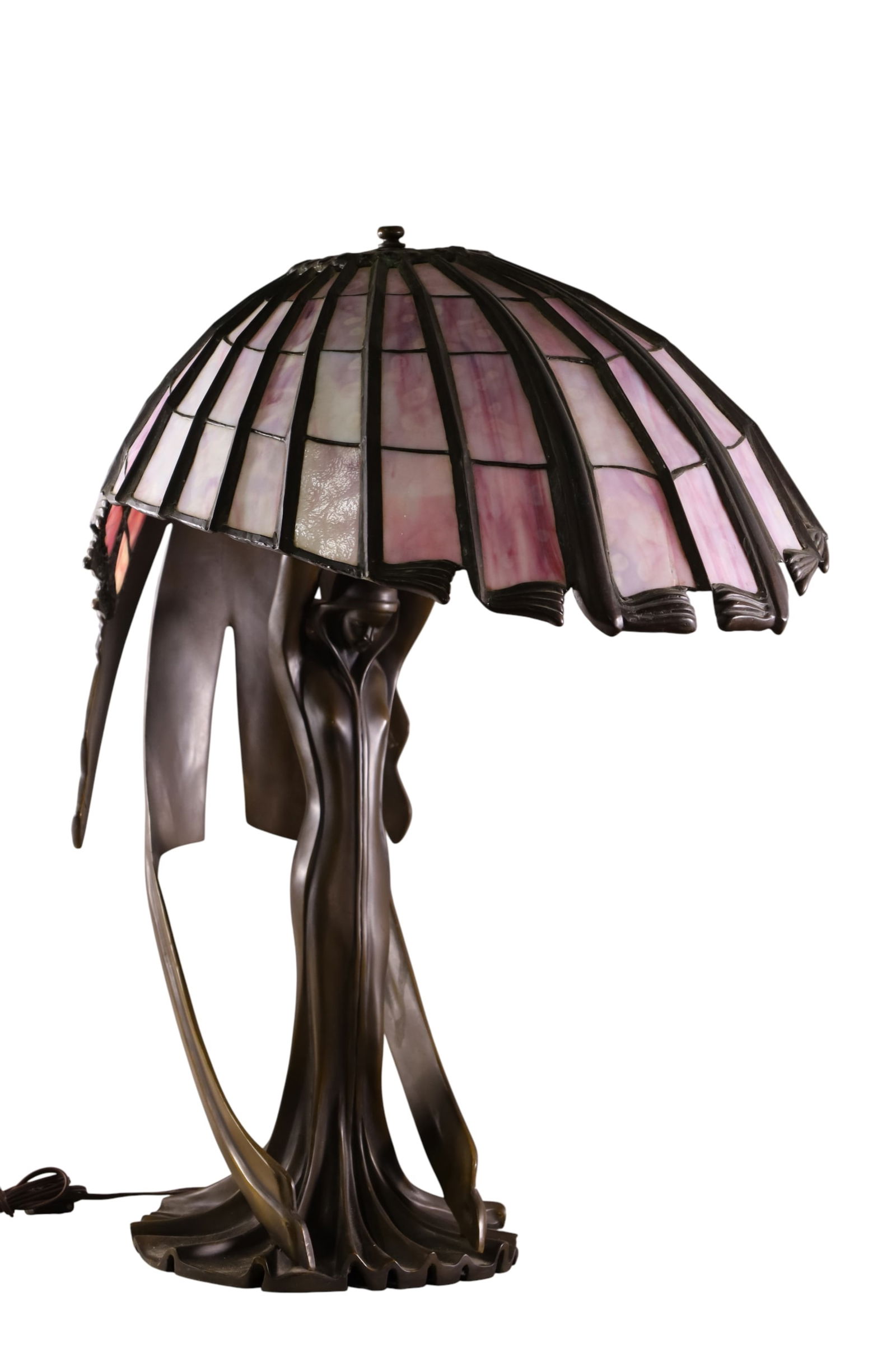 ART NOUVEAU STYLE LADY LAMP: LARGE ART NOUVEAU STYLE BRONZE LADY LAMP, AFTER PETER BEHRENS, SLAG GLASS LADY LAMP, ONE CRACKED PANEL. 18" W x 30" H. THIS ITEM EXCEEDS SIZE LIMITATIONS FOR IN HOUSE SHIPPING, MUST BE PICKED UP