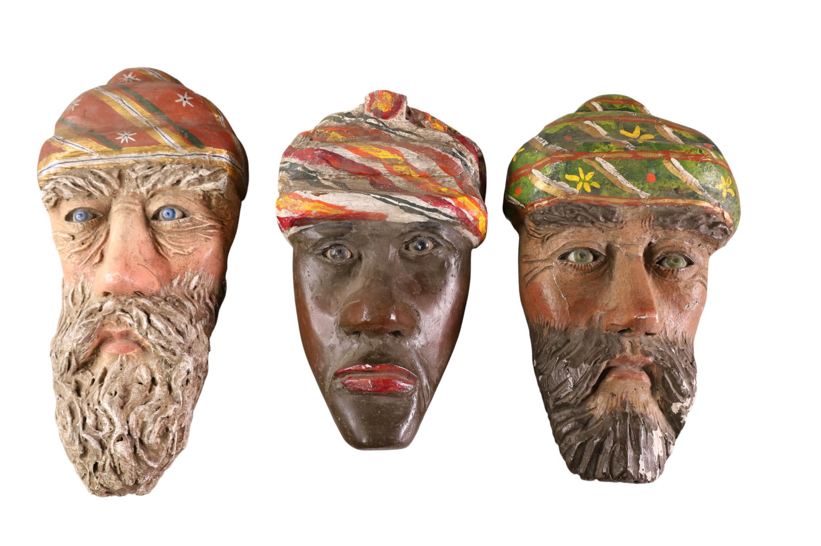 3 CARVED WOOD WISEMEN PLAQUES: 3 WALL HANGING CARVED WOOD FACES OF THE 3 WISEMEN. GLASS EYES. 13" - 16" H.