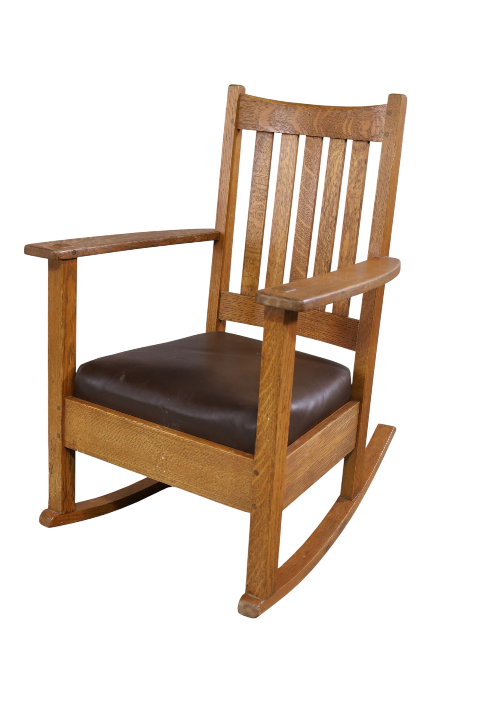 ARTS & CRAFTS LIMBERT OAK ROCKER: MISSION OAK ARTS & CRAFTS LIMBERT ROCKER, SLAT BACK. SIGNED UNDER LEFT ARM. 25" W x 19" D x 34" H. THIS ITEM EXCEEDS SIZE LIMITATIONS FOR IN HOUSE SHIPPING, MUST BE PICKED UP IN HOUSE OR SHIPPED 