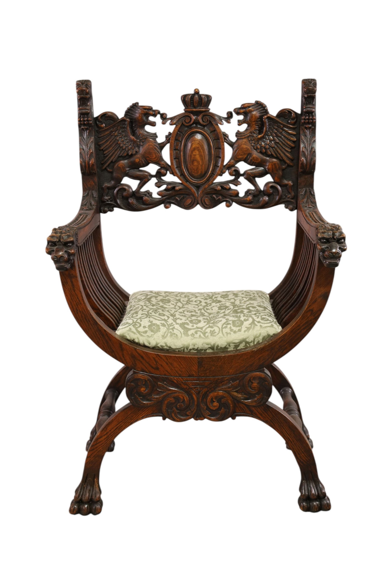 CARVED GOTHIC BARREL CHAIR: HIGHLY CARVED GOTHIC THRONE OR BARREL CHAIR, LION CARVED HANDLES, WINGED GRIFFIN BACK, MINOR WEAR TO FINISH. 27" W x 19" D x 41" H. THIS ITEM EXCEEDS SIZE LIMITATIONS FOR IN HOUSE SHIPPING, MUST