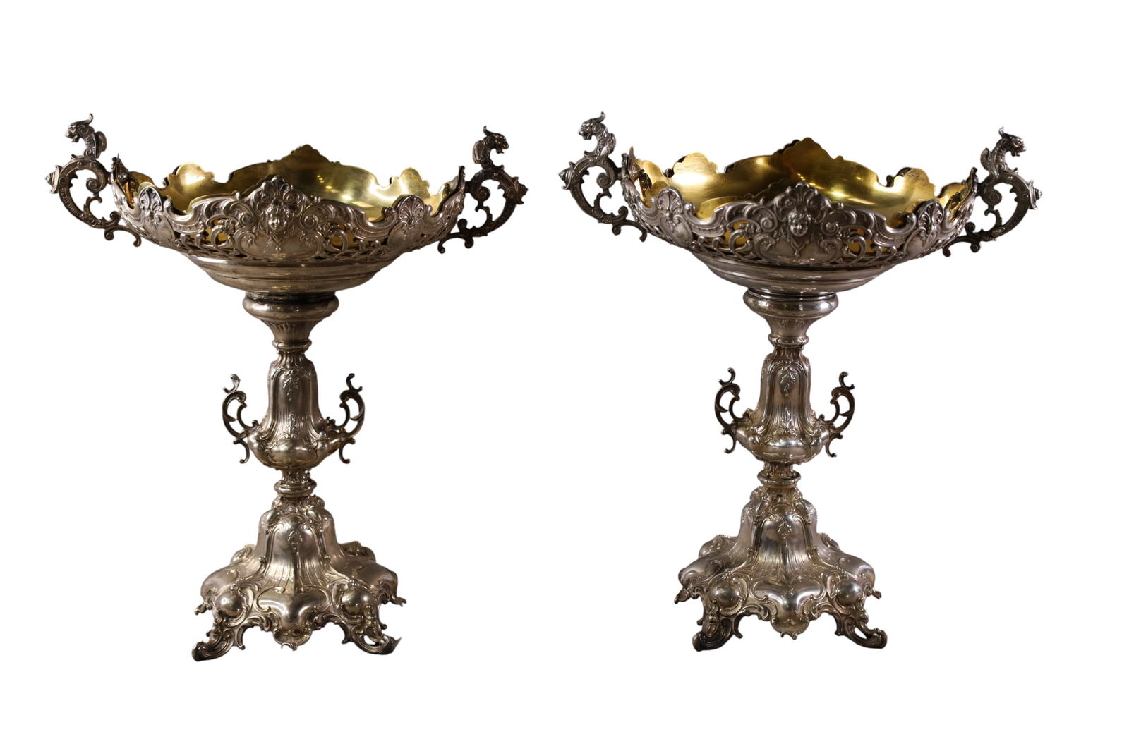 PAIR OF ORNATE 800 SILVER COMPOTES: PAIR OF LARGE ORNATE GERMAN 800 SILVER COMPOTES, WITH DRAGON FORM HANDLES, GOLD WASHED INSERT TRAYS. APPROX 2576 GRAMS WITHOUT TRAYS,
