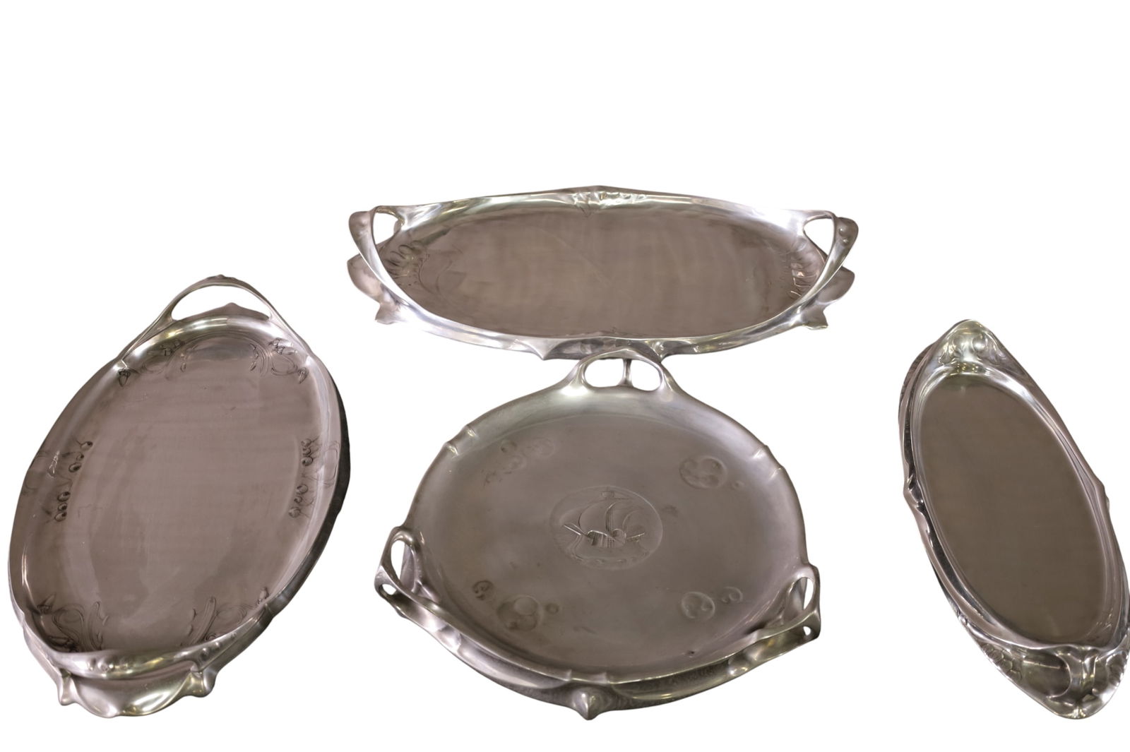 4 ART NOUVEAU TRAYS: 4 ART NOUVEAU PEWTER TRAYS, 14" - 21" W.