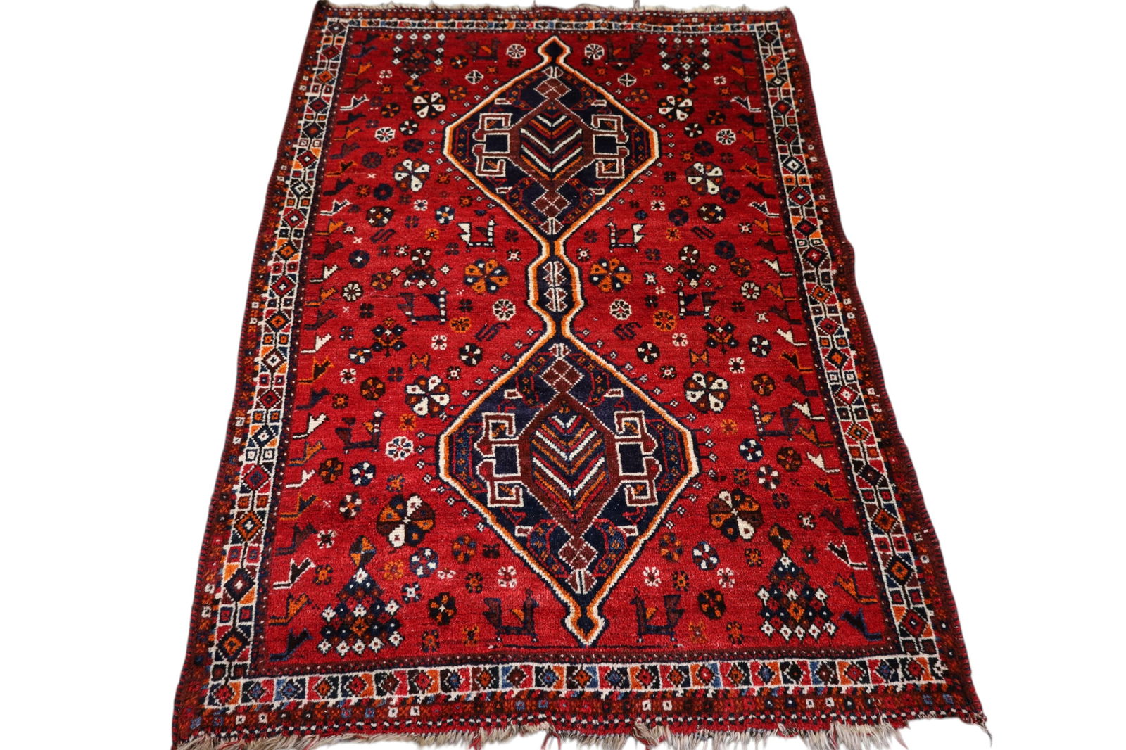 APPROX 5' 2" x 3' 10" HANDMADE WOOL RUG: END LOSS.