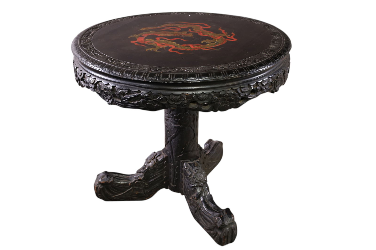 JAPANESE INLAID CENTER TABLE: HIGHLY CARVED LACQUERED CENTER TABLE WITH DRAGON DECORATED TOP. WEAR TO FINISH. SOME CHIPS TO CARVING. 32" DIAM x 29" H. THIS ITEM EXCEEDS SIZE LIMITATIONS FOR IN HOUSE SHIPPING, MUST BE PICKED 