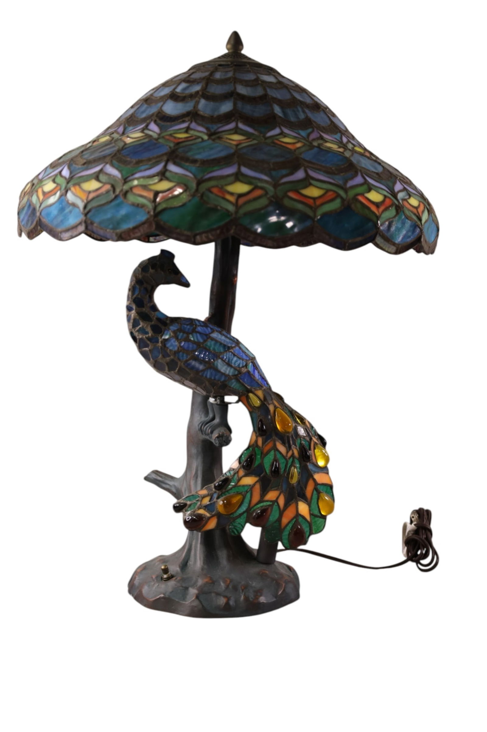 CONTEMPORARY LEADED GLASS LAMP: LEADED GLASS AND JEWELED PEACOCK FORM TIFFANY STYLE TABLE LAMP. 20 1/2" DIAM x 27" H. THIS ITEM EXCEEDS SIZE LIMITATIONS FOR IN HOUSE SHIPPING, MUST BE PICKED UP IN HOUSE OR SHIPPED VIA 3rd PARTY