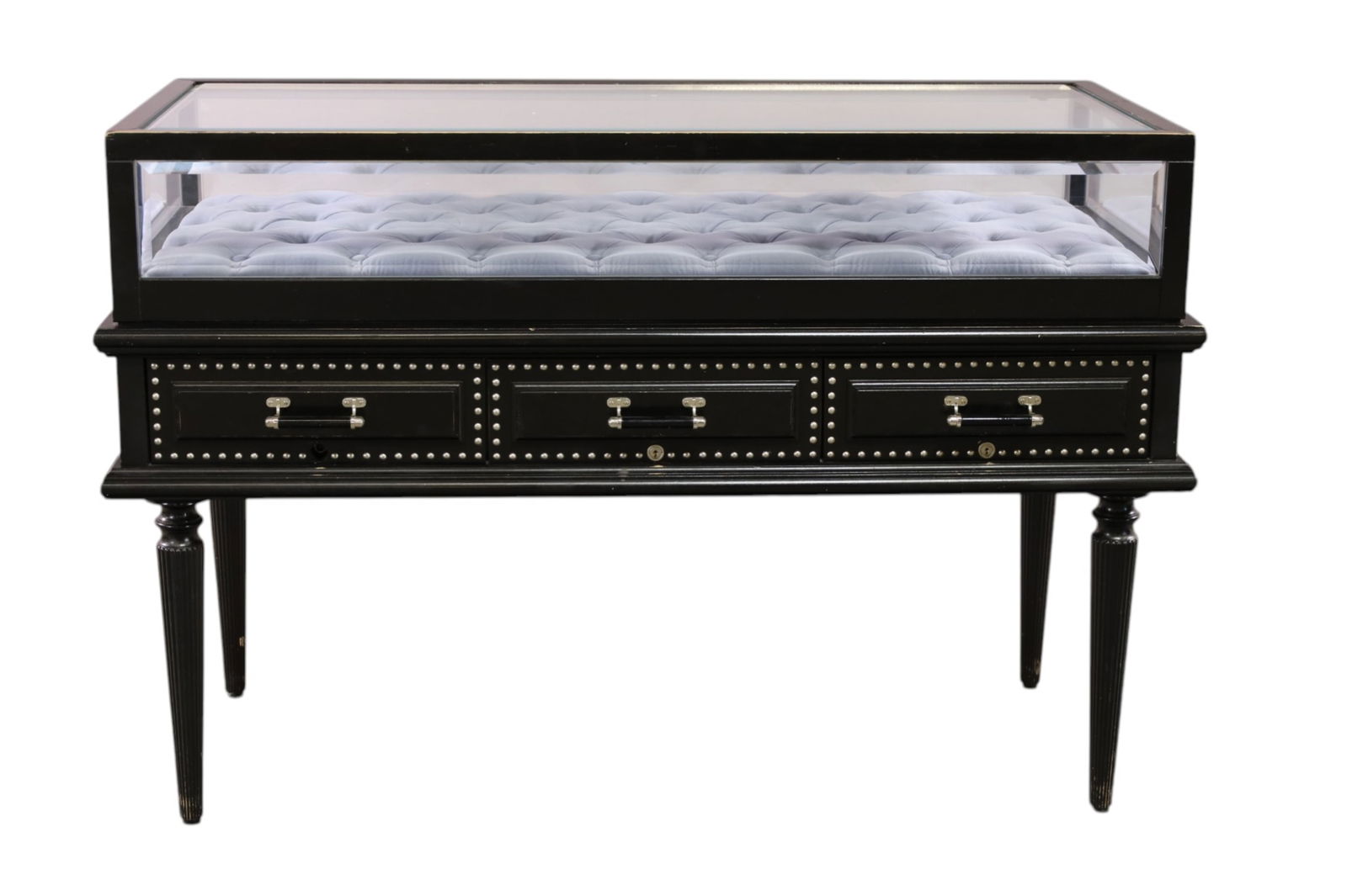 CONTEMPORARY SHOWCASE: GLASS TOP, THREE LOWER DRAWERS, TUFTED INTERIOR. FROM A GUCCI SHOWROOM. SOME PAINT LOSS TO FINISH. 55" W x 26 D x 37" H. THIS ITEM EXCEEDS SIZE LIMITATIONS FOR IN HOUSE SHIPPING, MUST BE PICKED 