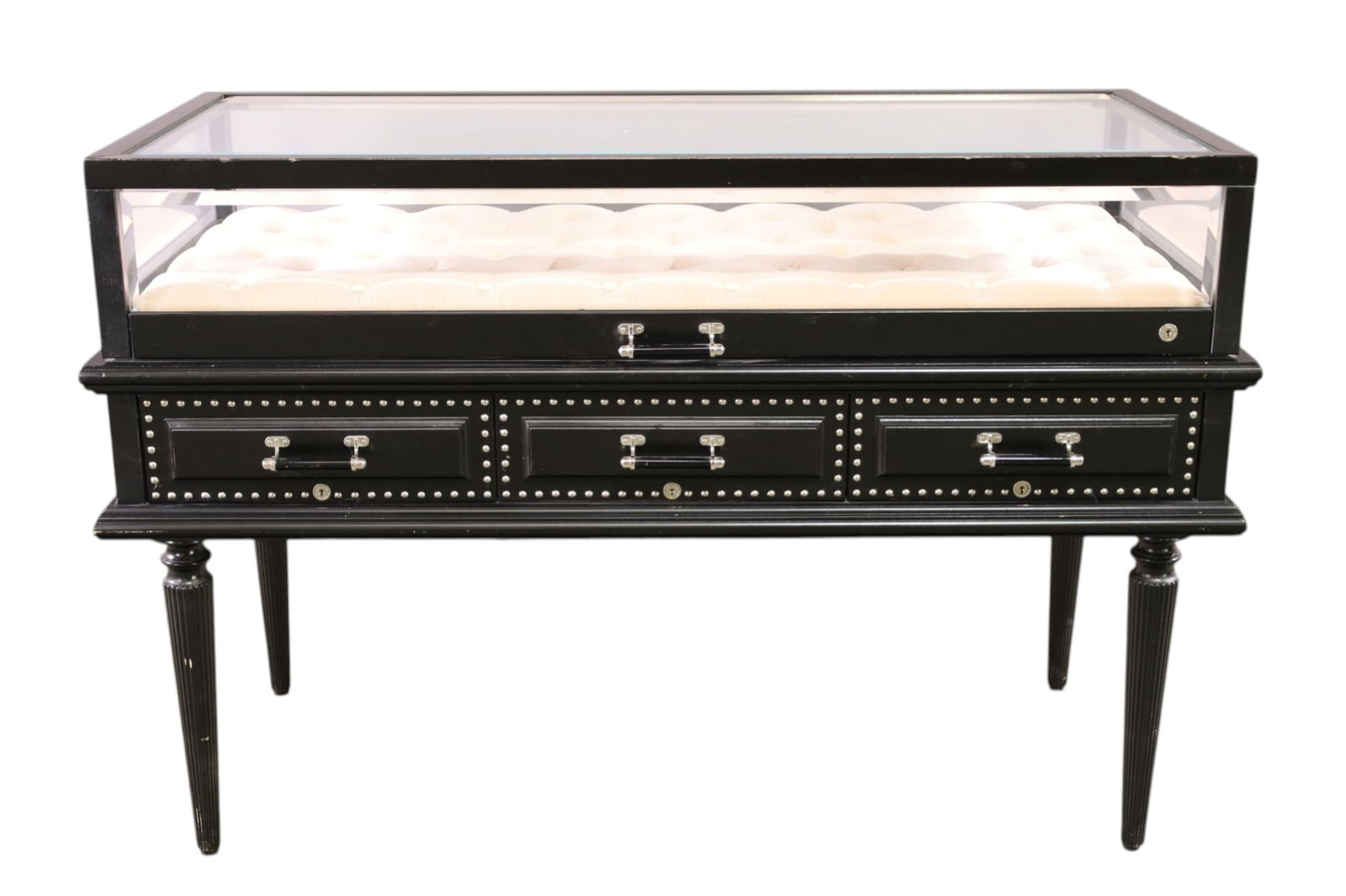 CONTEMPORARY SHOWCASE: GLASS TOP, THREE LOWER DRAWERS, TUFTED INTERIOR, FROM A GUCCI SHOWROOM. SOME PAINT LOSS TO FINISH. 55" W x 26" D x 37" H. THIS ITEM EXCEEDS SIZE LIMITATIONS FOR IN HOUSE SHIPPING, MUST BE PICKED 
